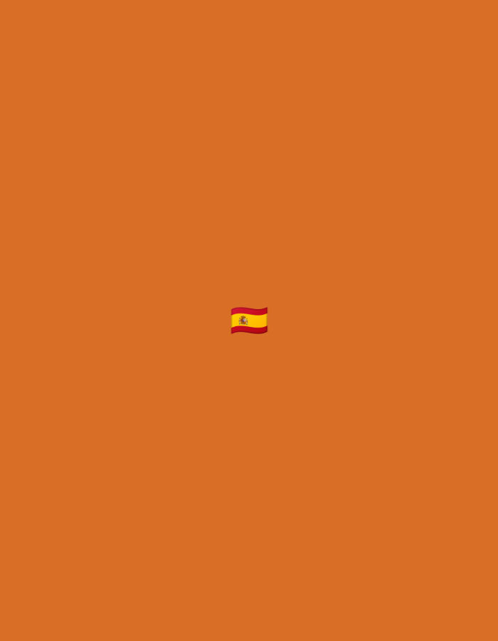 The image displays a minimalist composition featuring a single emoji of the flag of Spain, centered against a plain, solid orange-brown background. The flag emoji is rendered with a slight waving effect, showing its iconic horizontal stripes: a wider yellow band in the middle, bordered by narrower red bands at the top and bottom. A simplified representation of the Spanish coat of arms is visible on the yellow stripe towards the hoist side. The background is unadorned, lacking any other objects, people, or discernible scenery. There is no visible text or specific activity taking place within the frame. The overall impression is a clear and direct presentation of the Spanish flag against a neutral, monochromatic backdrop.