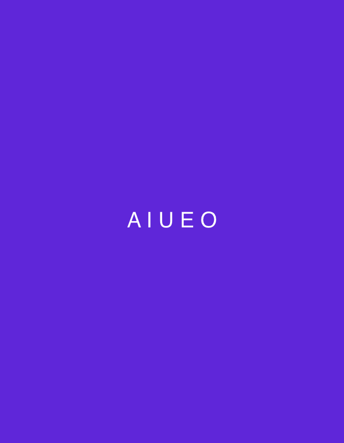 The image displays a minimalist graphic design featuring the white text "AIUEO" centered on a solid, vibrant purple background. There are no identifiable subjects such as people or specific objects, and no activity or event is taking place. The scene is abstract, dominated by the single color and the clear, uppercase text.
Notable details include the striking contrast between the bright white lettering and the rich purple hue of the background. The font appears to be a clean, sans-serif style. No specific time of day, weather conditions, or emotions are conveyed by the design. While the location context is provided as Lhokseumawe, Indonesia, the image itself offers no visual cues or elements that depict or refer to this specific geographical location; it is a purely graphical representation. The provided crops confirm the consistent purple background and the central placement of the white text "AIUEO" without revealing any additional visual information.