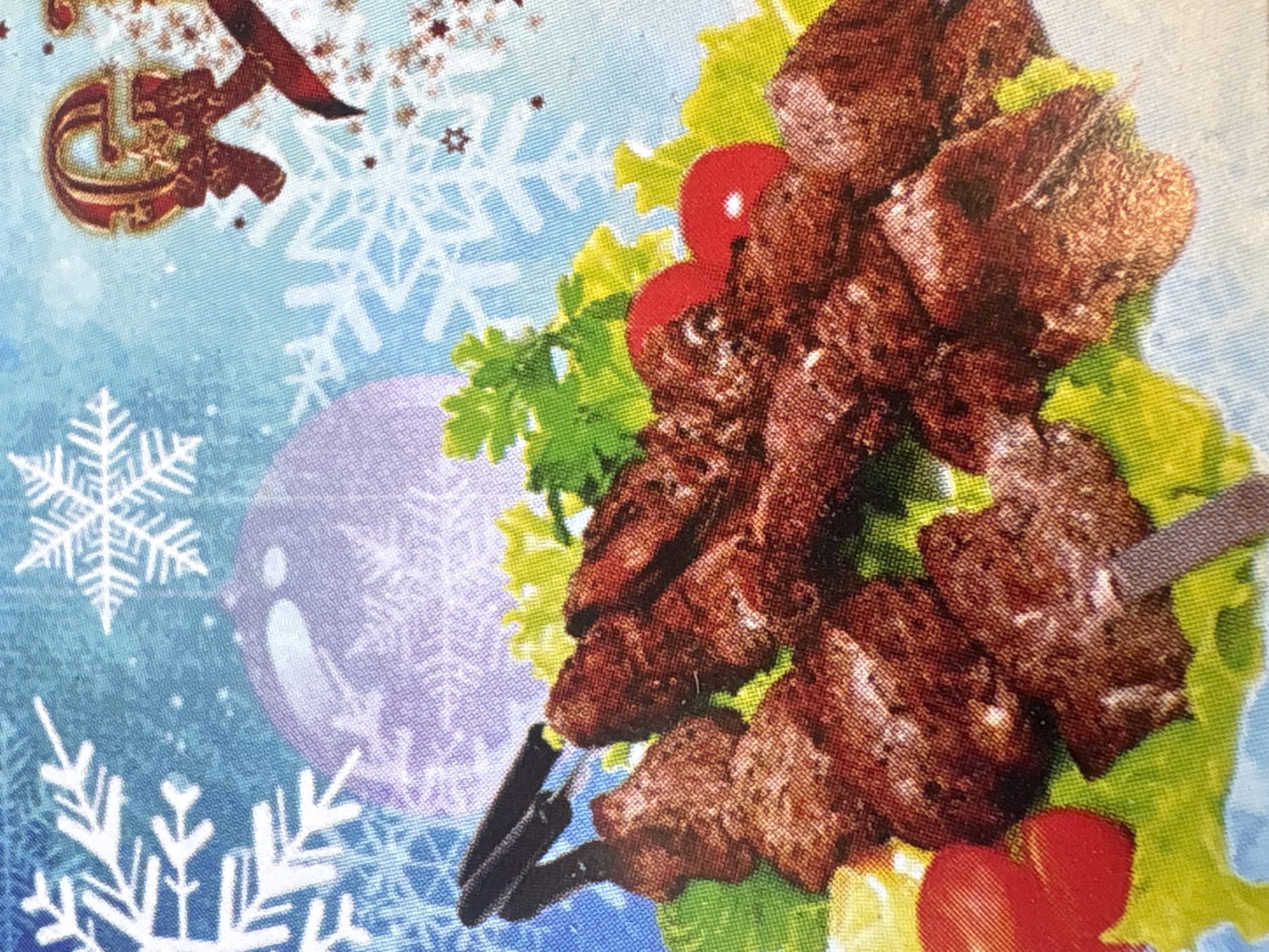 The image shows a Christmas-themed napkin with an image of shashlik skewers on a bed of lettuce and cherry tomatoes. The background is light blue with snowflakes and Christmas ornaments. The city of Krasnoyarsk, Russia is not mentioned in the image.
