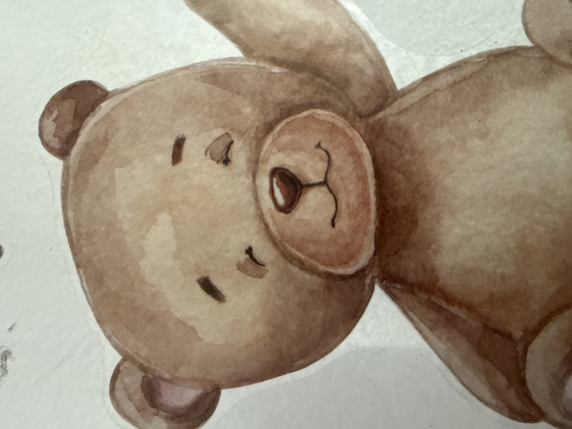 The image is a close-up watercolor painting of a cartoon teddy bear. The bear is light brown with darker brown accents on its ears, nose, and eyes. It has a round face with closed eyes, a small smile, and a reddish-brown nose. Its right arm is raised as if waving. The background is a plain, textured white. There is no discernible location in the city of Ushtobe, Kazakhstan, or any real-world environment depicted.