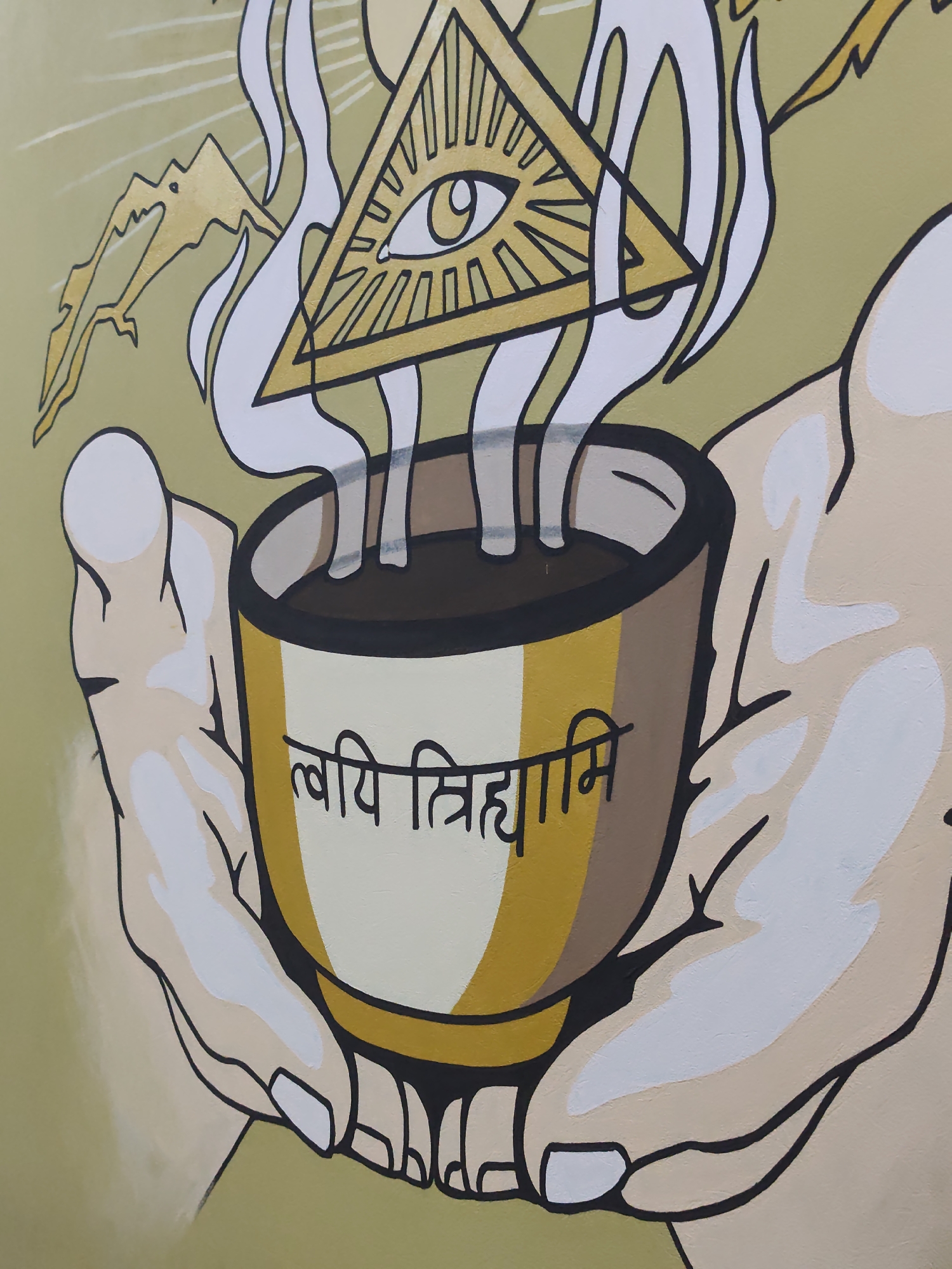 The image is a close-up of a mural. In the center, two hands hold a steaming bowl. Above the bowl, a triangle with an eye inside is depicted, with rays emanating from it. The bowl has script written on it, which appears to be in a non-Latin alphabet. The overall style of the mural is cartoonish and uses bold black outlines and flat colors. The background is a solid pale green. The mural is located in Sochi, Russia, on the exterior wall of a cafe called "La Luna" on Chernomorskaya Street, building 18.