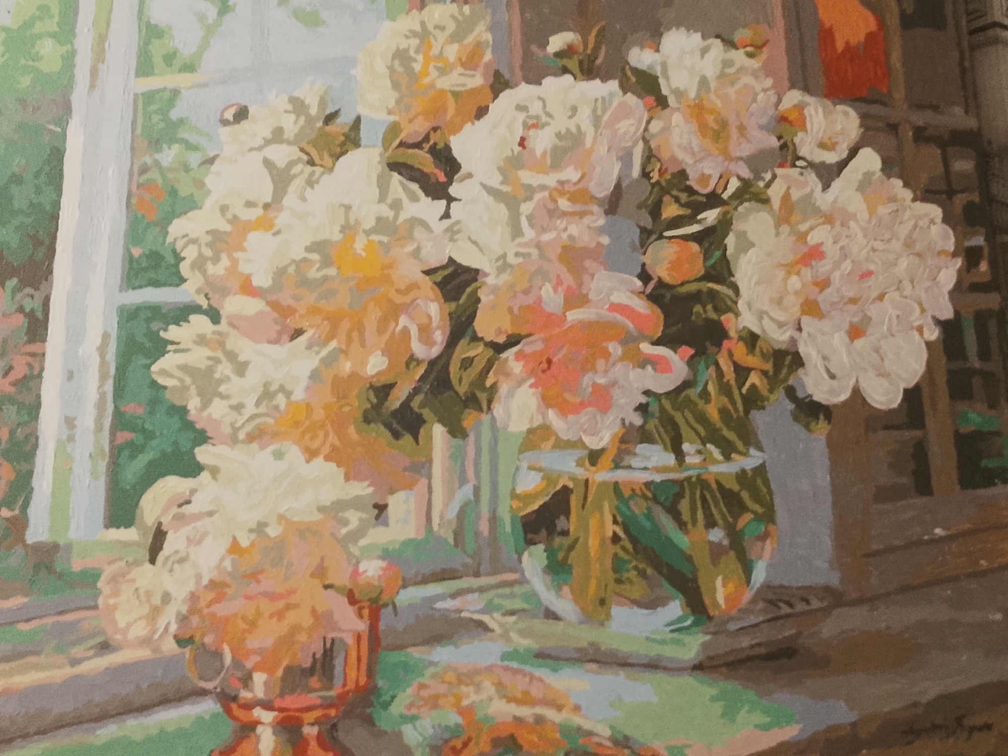 This is a painting of a still life featuring a bouquet of peonies in a glass vase. The vase sits on a surface, possibly a windowsill, with a window in the background. The peonies are a mix of white and peachy hues with some pink accents. To the left of the vase, there is a smaller vase or decorative object. The background behind the window appears to be foliage. The style of the painting is somewhat impressionistic, with visible brushstrokes. The overall color palette is warm and soft. The painting is signed in the lower right corner, but the signature is illegible. There is no indication of any specific location in Moscow, Russia.
