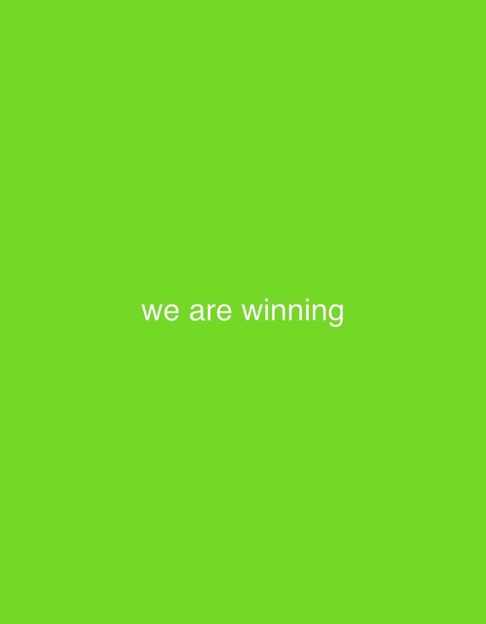 The image is a solid bright green background with the text "we are winning" centered in white. The text is in a sans-serif font. There are no people, objects, actions, interactions, or environmental details to describe. The image does not depict the city of Ogbomosho, Nigeria or any specific location.