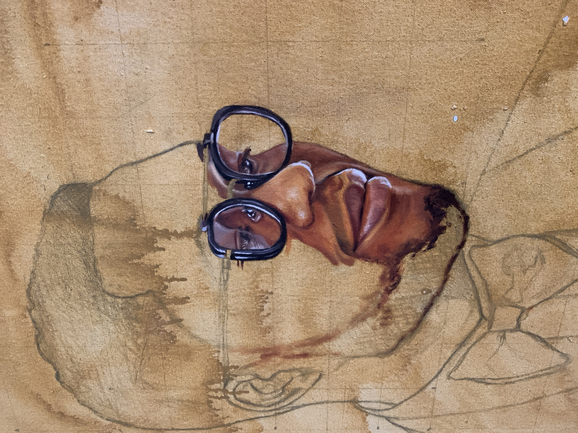 The image is a close-up, work-in-progress painting of a man's face, rendered in warm, earthy tones. The painting is on a textured canvas, possibly linen, with visible brushstrokes and some drips of paint. The man is depicted from the chest up, facing to the right of the frame. He is wearing round, thick-rimmed glasses. The left side of his face, including his ear and the outline of his head, is sketched with lighter lines, suggesting it is still in the early stages of the artwork. The right side of his face is more developed, with color applied to his skin, emphasizing his nose, lips, and the glint in his eyes through the glasses. His lips are full and painted with highlights, giving them a moist appearance. A bow tie is sketched around his neck, also in the early stages of development. The background is a uniform, light brown, with subtle variations in tone. There are a few small specks of white paint visible on the canvas. The overall impression is of a detailed portrait in progress, focusing on the facial features and the play of light on the skin and through the spectacles.
