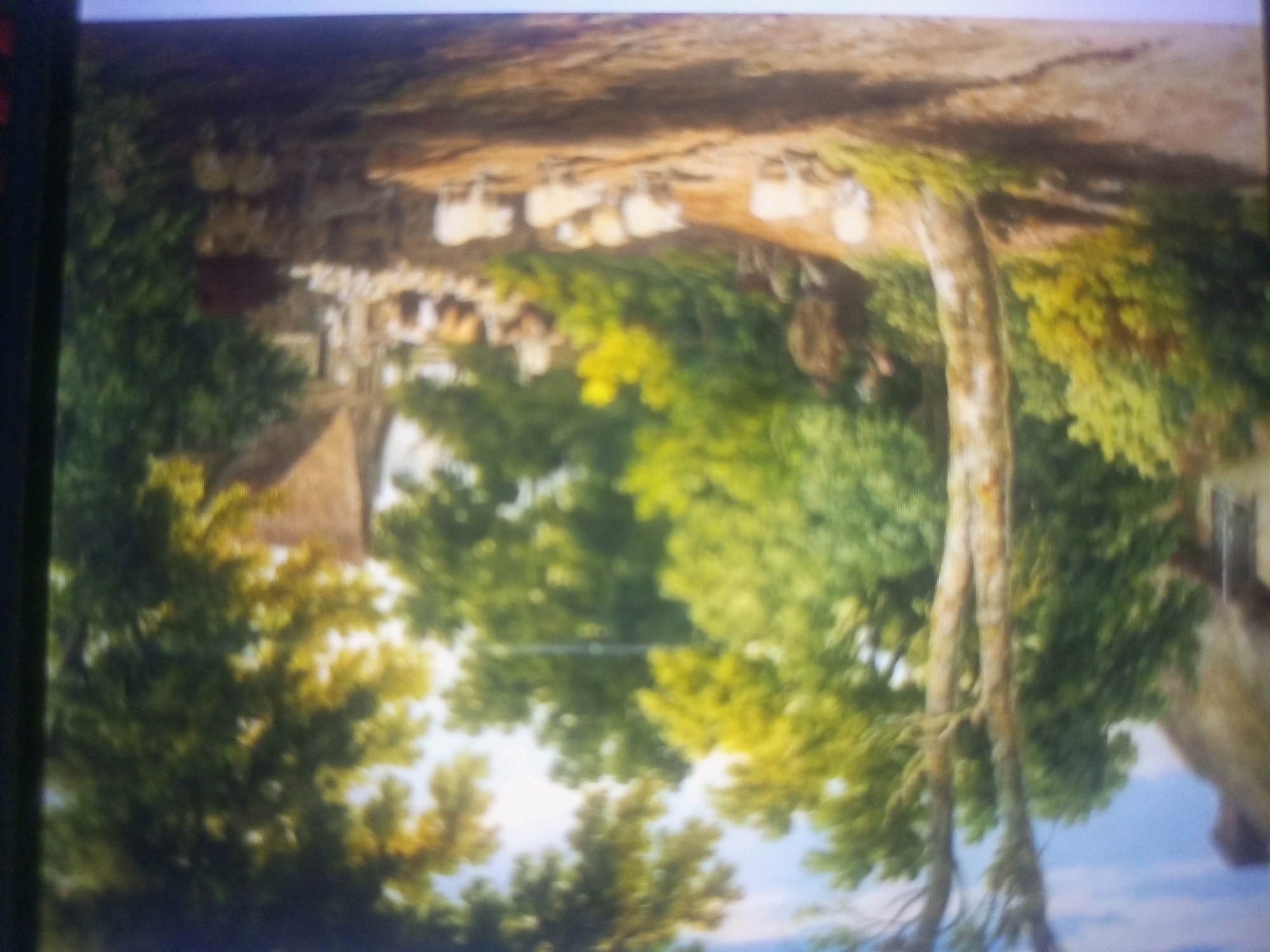 The provided image is a photograph of a painting. The painting depicts a pastoral scene with a flock of sheep being herded along a path. Several figures, presumably shepherds, are visible among the sheep. The landscape is characterized by trees with lush green foliage, a dirt path, and what appears to be a building or dwelling in the background. The overall impression is one of a rural, idyllic setting. The image does not contain any information that can identify the location as Gajju Matah, Pakistan, or any other specific geographical location.
