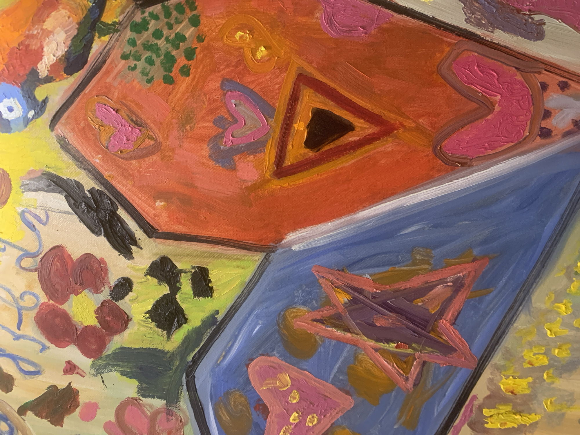 The image is a close-up of an abstract oil painting. The painting is composed of geometric shapes filled with bright, contrasting colors. Prominent shapes include a red-orange square with a triangle at its center, and a blue square with a star inside. There are also pink heart-like shapes scattered throughout. Patches of green, yellow, and other colors are visible in the background and surrounding the geometric figures. The brushstrokes are thick and textured.
The location of Moscow, Russia, is not depicted in the image. It is a studio shot of a painting.
