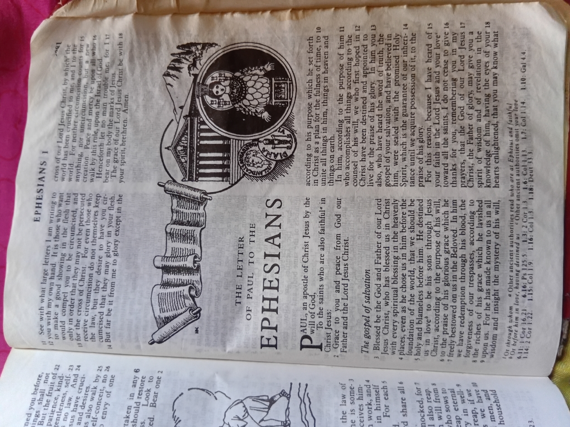 This media file is a close-up, overhead shot of an open page of a Bible, likely from an older edition given the typeface and illustrations. The page itself is yellowed and slightly creased, indicating its age and use. The Bible is open to the Book of Ephesians, with the title "EPHESIANS I" prominently displayed in large, bold capital letters.
The text is a mix of English scripture and accompanying commentary. Several verses are numbered, indicating biblical passages. Accompanying the text are two detailed black and white illustrations. The first, on the right, is a circular illustration depicting a robed figure, possibly a saint or biblical character, with intricate patterns on their clothing and a crown or headdress. This illustration is set against the backdrop of a classical architectural structure, like a temple or basilica. Below this, a smaller circular illustration shows a profile of a person's head, reminiscent of ancient coins. On the left side of the page, there is another illustration of a rolled-up scroll, detailed with lines to mimic parchment, tied with a string.
Visible text includes chapter and verse numbers (e.g., 12, 13, 14, 15, 16, 17, 18, 22, 23, 24, 25, 26), book titles ("EPHESIANS I", "THE LETTER OF PAUL TO THE EPHESIANS"), and fragmented sentences from the scripture and its notes. There are also references like "Nkpor, Nigeria" and citation numbers like "6.11: 1 Cor.", "1.3: 2 Cor.", "1.10: Gal 4.4". The text also includes a phrase "The gospel of salvation."
The lighting is somewhat uneven, suggesting it was taken with artificial light or in a dimly lit room. There are no visible people in the image, only the Bible and its illustrations. The overall impression is one of study and reflection.
