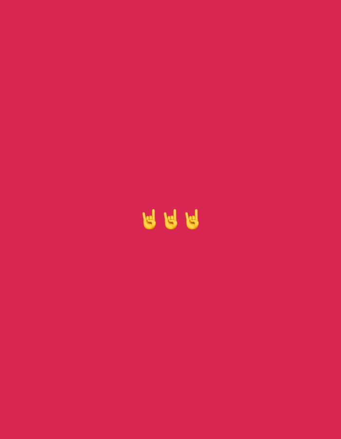 Three yellow "rock on" hand gesture emojis are displayed centrally on a plain pink background. The location in the city of Nowa Sól, Poland is not discernible from the image.