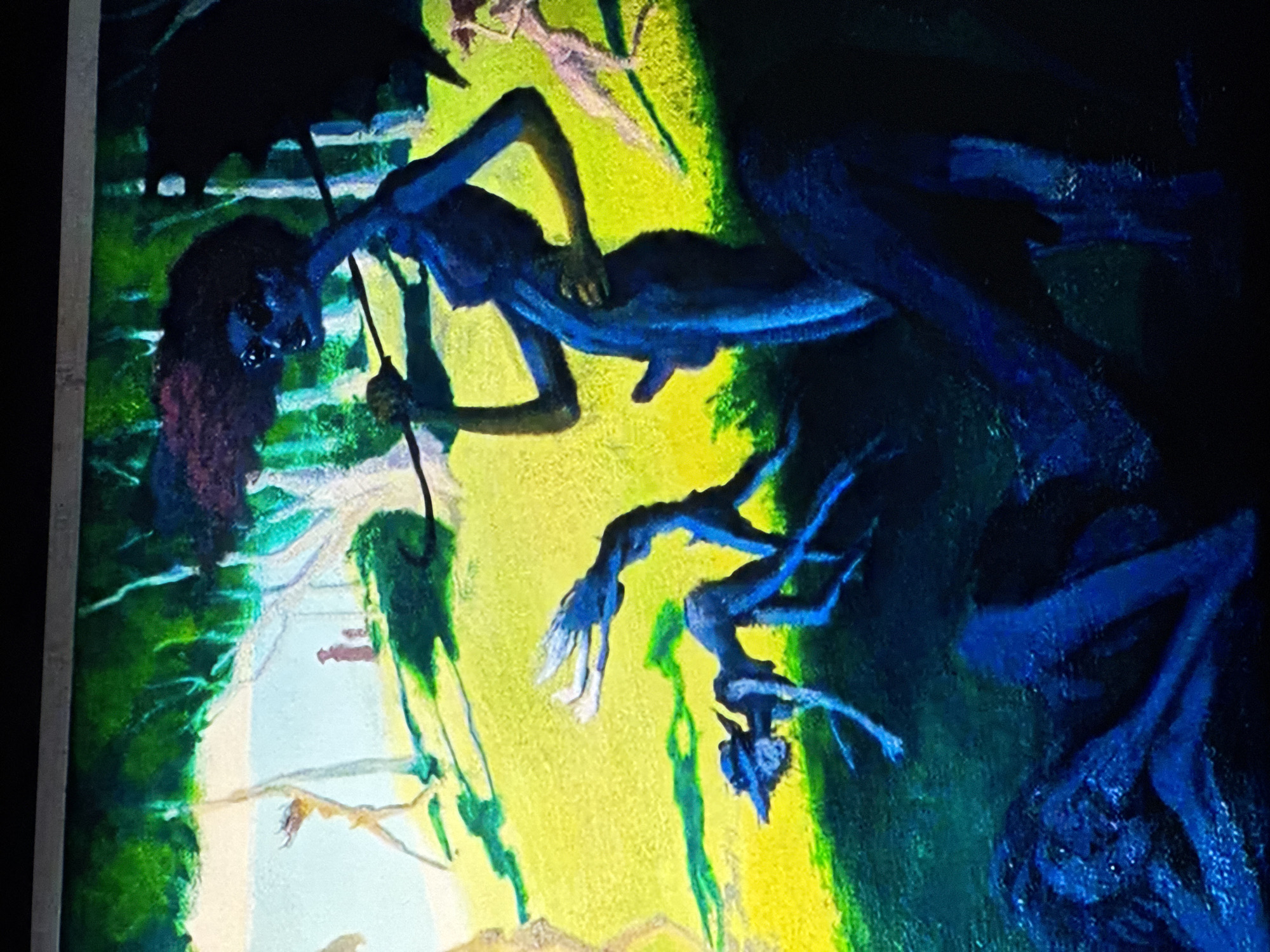 The image depicts a surreal painting featuring a blue figure with dark hair, possibly female, holding an umbrella. The figure is positioned against a background of green, yellow, and blue hues, suggesting a dreamlike or fantastical environment. There are also vaguely defined shapes and structures, possibly representing trees, branches, or other objects. The exact location is unknown.