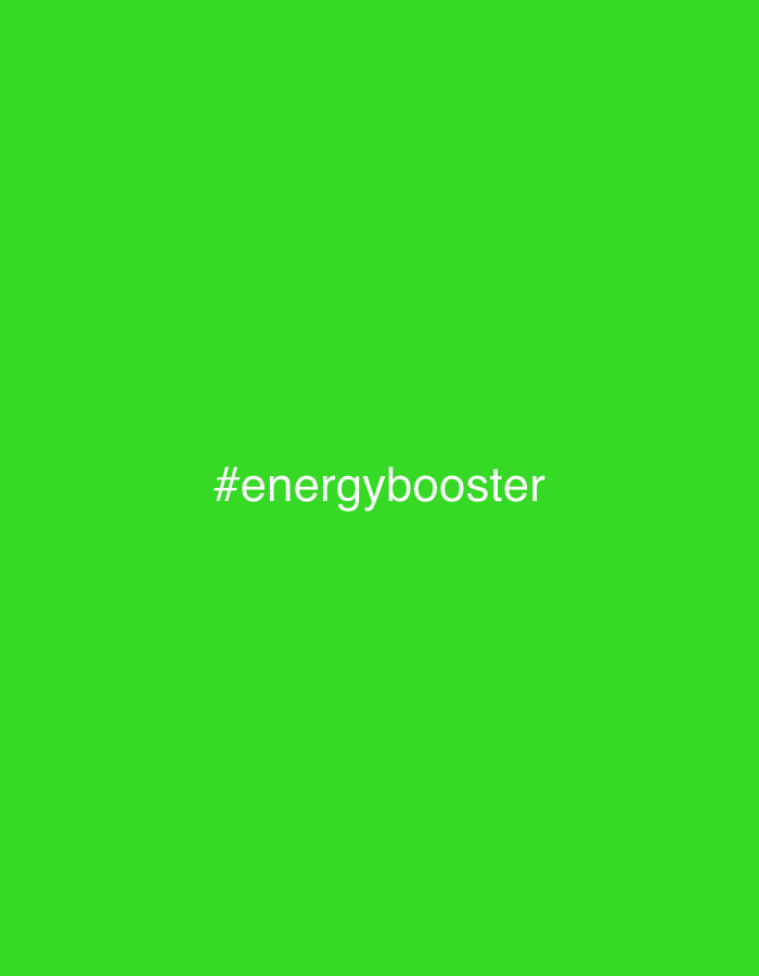 The image displays a plain, vibrant green background. Centered on this monochromatic canvas is the text "#energybooster" rendered in white, sans-serif lettering. There are no other visible subjects, objects, or discernible activities taking place. The image lacks any specific cues regarding time of day, weather, or location.