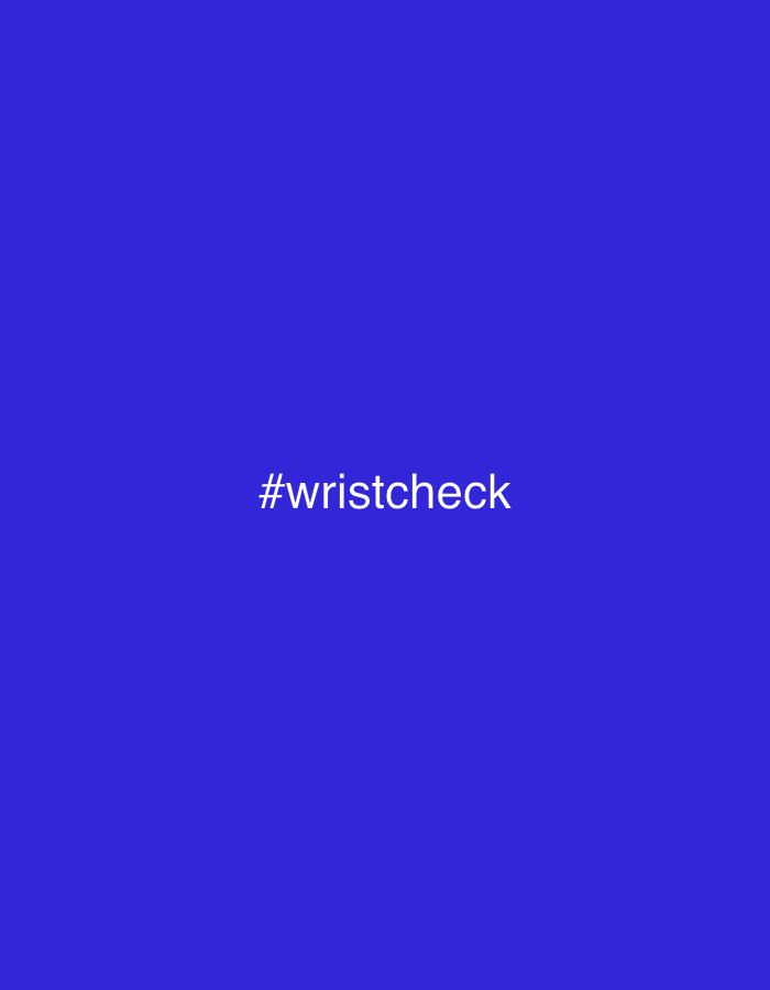 A still image displays the text "#wristcheck" centered on a vibrant, solid blue background.