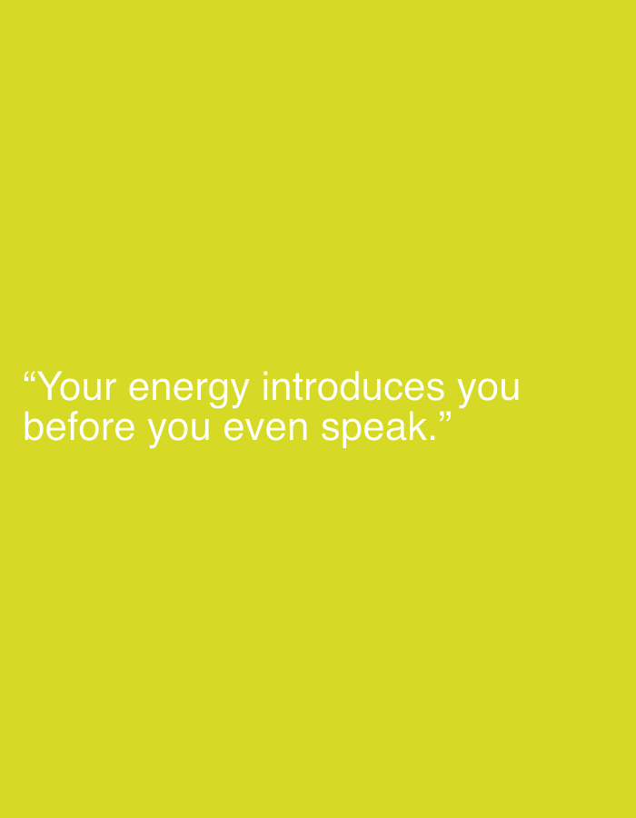 The image displays a minimalist graphic featuring white text on a solid, vibrant yellow background. The yellow color is a bright, almost chartreuse or lime green hue, dominating the entire frame. The text, presented in a clean, sans-serif font, is horizontally centered and positioned towards the bottom third of the image. It reads: "“Your energy introduces you before you even speak.”" The quote is enclosed in quotation marks. There are no other subjects, objects, people, or discernible activities. The scene is devoid of any specific location cues, weather conditions, or time of day, functioning as a digital visual or a simple poster designed to convey a message. The overall impression is direct and thought-provoking due to the stark contrast of the white text against the vivid background and the nature of the quote itself.