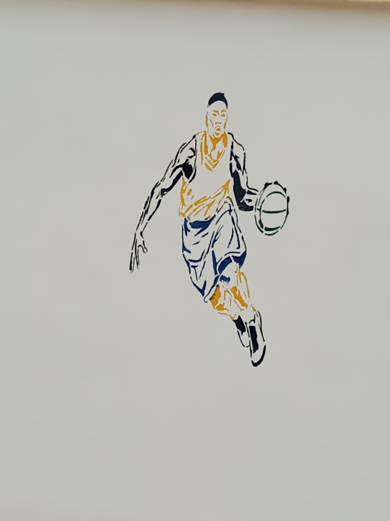 The image depicts a stylized illustration of a basketball player in motion, dribbling a ball. The artwork is rendered in shades of yellow, blue, and black against a plain, light-colored background. The player is depicted mid-stride, with one leg extended and the other bent, suggesting active movement. The basketball is shown in front of the player, near their right hand. The overall aesthetic is that of a silhouette or stencil art. There is no visible indication of the city of Jalingo, Nigeria, in the image itself. The scene is entirely contained within the artwork and the neutral background.
