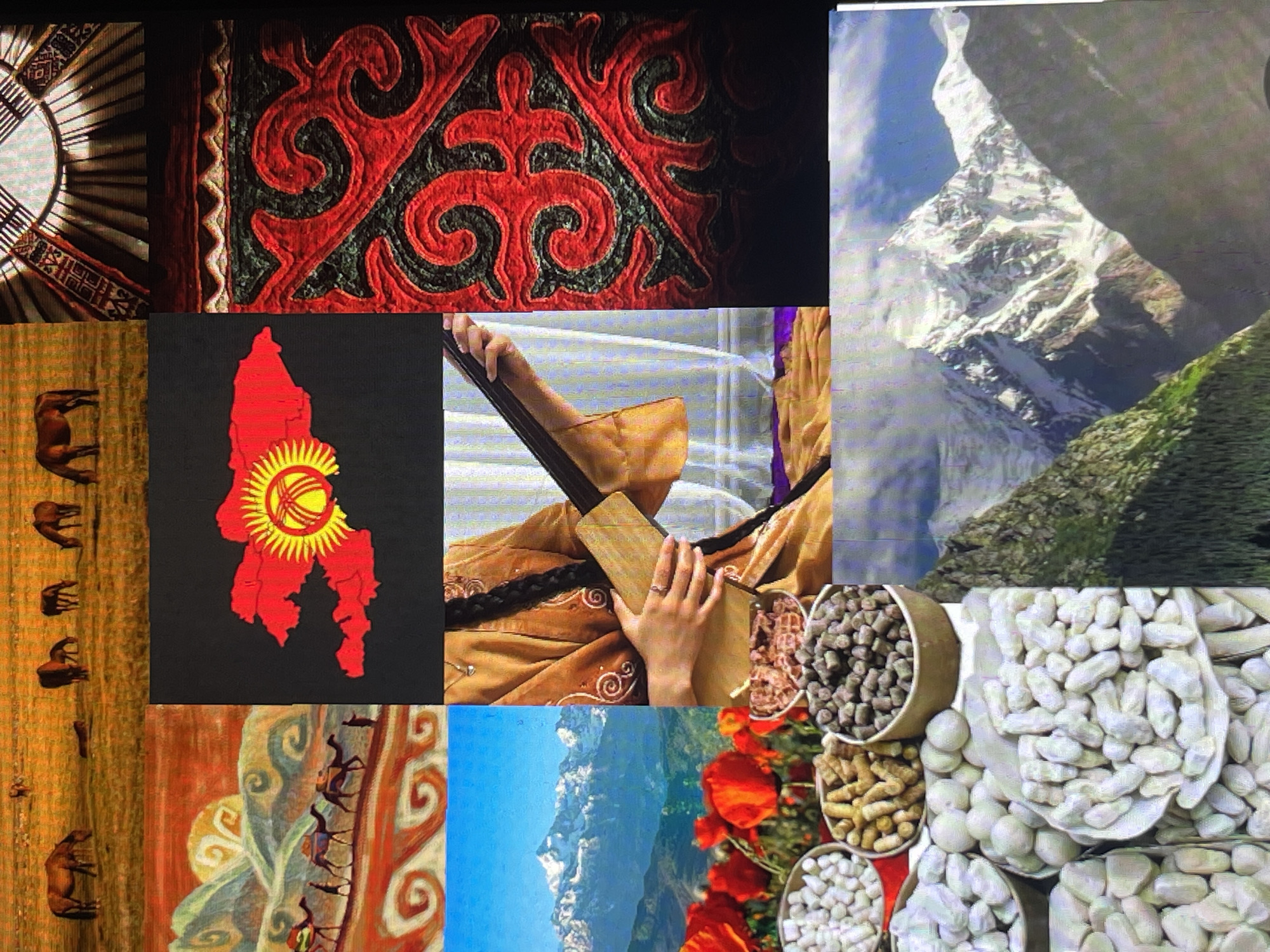 The image is a collage of various scenes, likely depicting aspects of Kyrgyzstan. The top left shows a painting of horses grazing in a field. The top right displays the interior of a yurt, a traditional nomadic dwelling, with its characteristic wooden lattice and felt covering. The middle left features another painting with a desert landscape and camels on a caravan route, under a stylized sun. The center of the collage shows the flag of Kyrgyzstan, a red flag with a yellow sun in the middle that has a tündük (the crown of a yurt) inside it, superimposed on a black background. To the right of the flag is a close-up of red and black traditional Kyrgyz textile patterns. The bottom left section presents a close-up of bowls filled with white beans and other dried goods, with poppies in the background and a snow-capped mountain range. The bottom right is a majestic view of a snow-covered mountain peak under a cloudy sky. The middle right shows a woman in traditional Kyrgyz attire, playing a stringed instrument. The collage aims to capture the diverse cultural and natural beauty of Kyrgyzstan.
