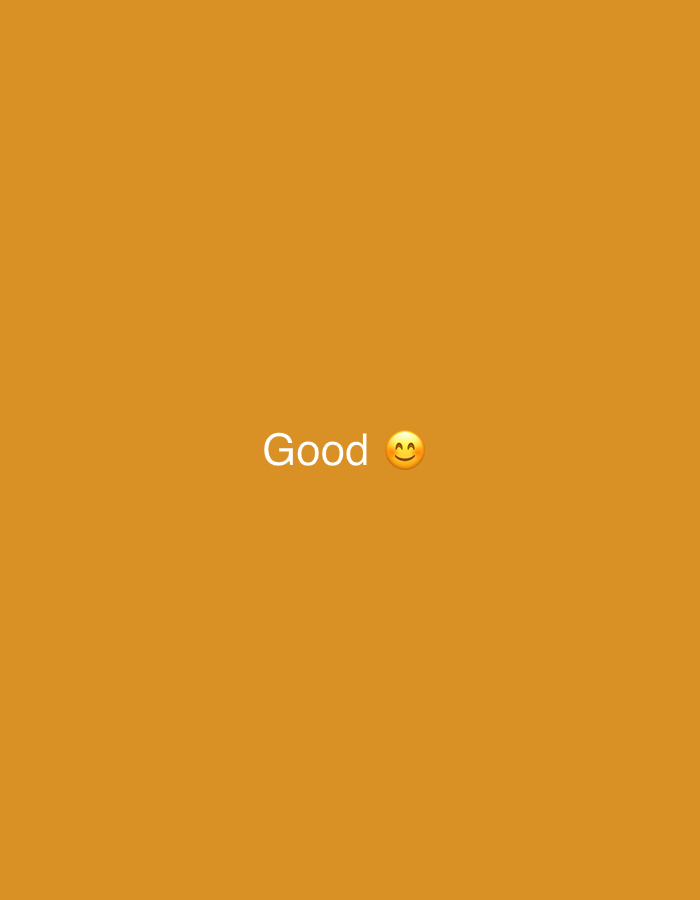 The image is a screenshot of a social media post or meme. It features the word "Good" written in white, stylized text, followed by a smiling emoji. The background is a solid, bright orange color. There are no recognizable landmarks or elements that would indicate a specific location in a city.