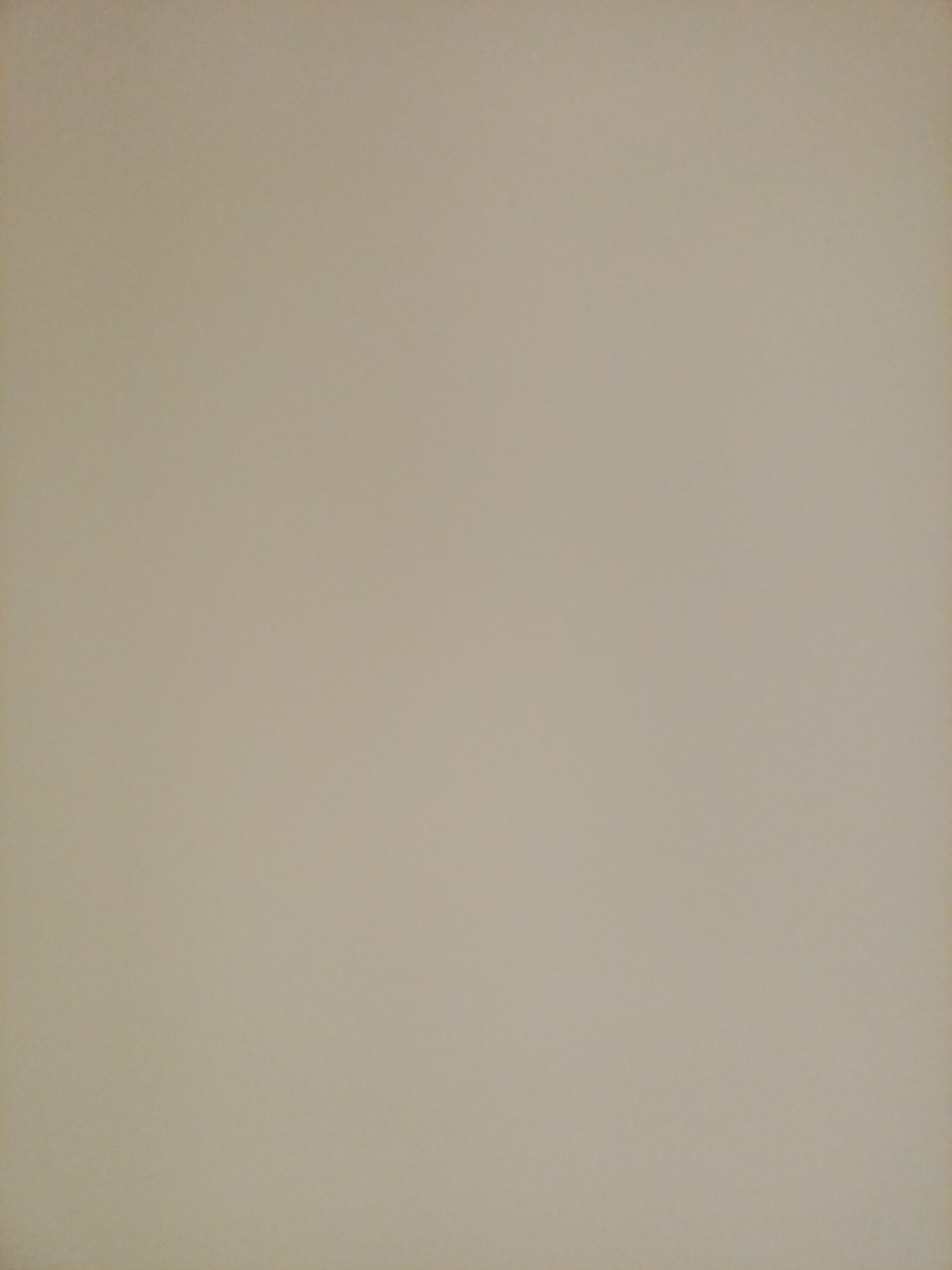 The image is a plain, textured background, appearing to be a wall or a sheet of paper. The color is a uniform, light beige or tan, with subtle variations in shading that suggest a rough surface. There are no discernible objects, people, or any discernible features that would indicate a specific location within Rostov-on-Don or any other city. The image is entirely abstract and devoid of contextual information.