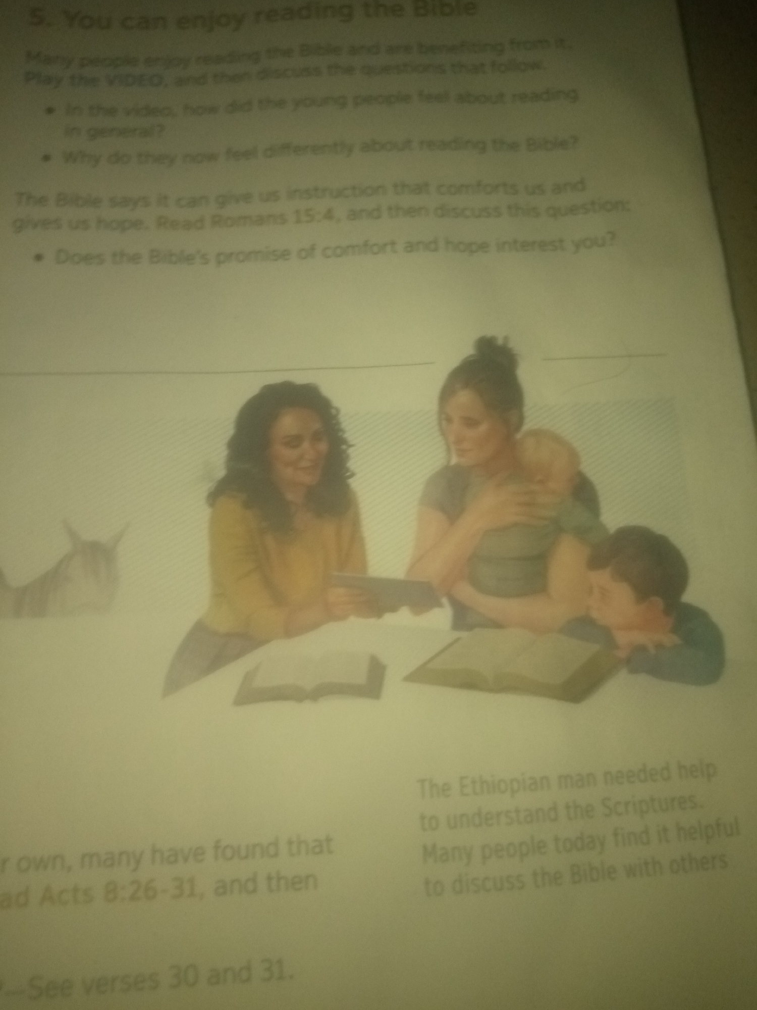 The image contains text and an illustration. The text is a lesson titled "5. You can enjoy reading the Bible." It discusses how people benefit from reading the Bible, mentions a video to watch, and poses questions for discussion. It also refers to Romans 15:4 and Acts 8:26-31.
The illustration depicts three people: a woman holding a baby, and a young boy looking down at an open book. Another woman with curly hair is visible on the left side of the illustration, also looking at an open book. There is also a blurred image of an animal that resembles a donkey or horse. The illustration suggests a scene of people engaging with religious texts.
There is no information in the image that indicates a location in the city of Jauro Yinu, Nigeria.