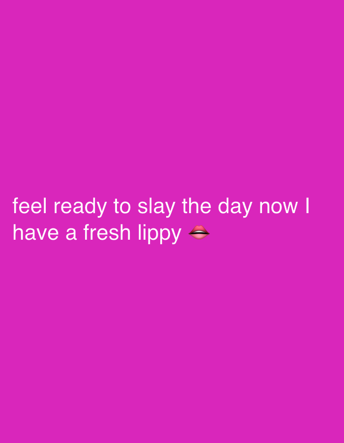 The image displays white text against a solid magenta-pink background. The text, centered on the left side of the frame, reads: "feel ready to slay the day now I have a fresh lippy 🫦". The last word "lippy" is followed by a biting lip emoji, which depicts a mouth with red lipstick. There are no other subjects, objects, or distinct scenes present in the image. The media is a graphic design conveying a feeling of confidence and preparedness, likely after applying lipstick or lip gloss. No time of day, weather, or specific location cues (other than the provided "London, United Kingdom" context, which is not visually represented) are visible.