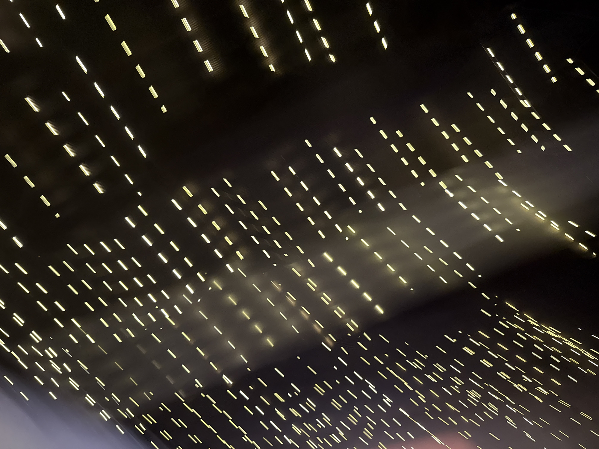 The image shows a dark ceiling with numerous small, rectangular lights arranged in a seemingly random pattern. The lights are a warm, yellowish color. The overall impression is of a starfield or a night sky with artificial stars. There is no information available to connect the image to Borzya, Russia. The image only shows an architectural detail.