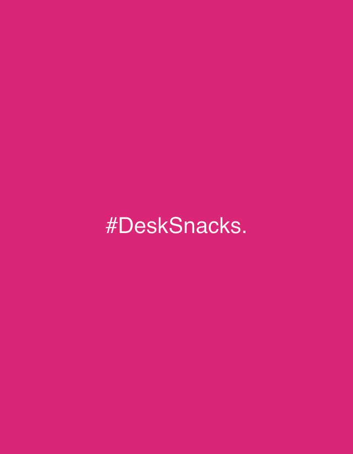 A magenta background with the text "#DeskSnacks." centered in white. There is no evidence suggesting this image is located in Barcelona, Spain, or any specific location.