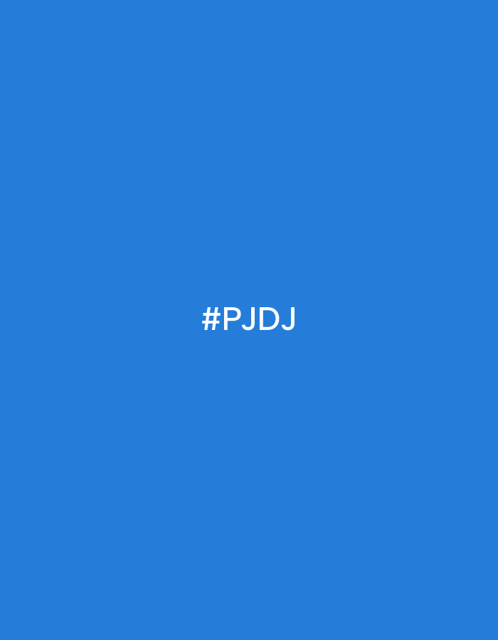 The image displays a plain, solid blue background. Centrally positioned on this background is the white text "#PJDj". There are no people, objects, or discernible scene elements present. No activity or event is depicted. The uniform blue hue fills the entire frame. The image lacks any specific cues regarding time of day, weather, or a particular physical location within Noviy, Russia, suggesting it is a digital graphic or color swatch rather than a photographic scene. The only notable detail is the distinct color and the overlaid hashtag.