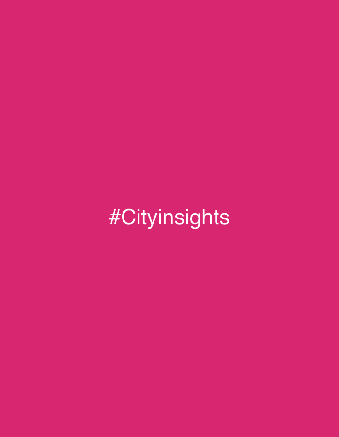 The image is a solid, bright pink background with the hashtag "#Cityinsights" in white, sans-serif font located near the center. There is no indication of location, people, subjects, objects, actions, interactions, or environment.