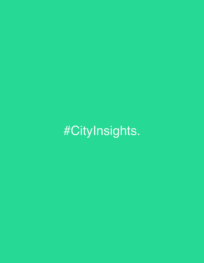 The image is a plain, solid green background with the white text "#CityInsights." centered on the screen. There are no other objects or details present in the image. The scene is not in Vavilovo, Russia, as the image does not depict any specific location.