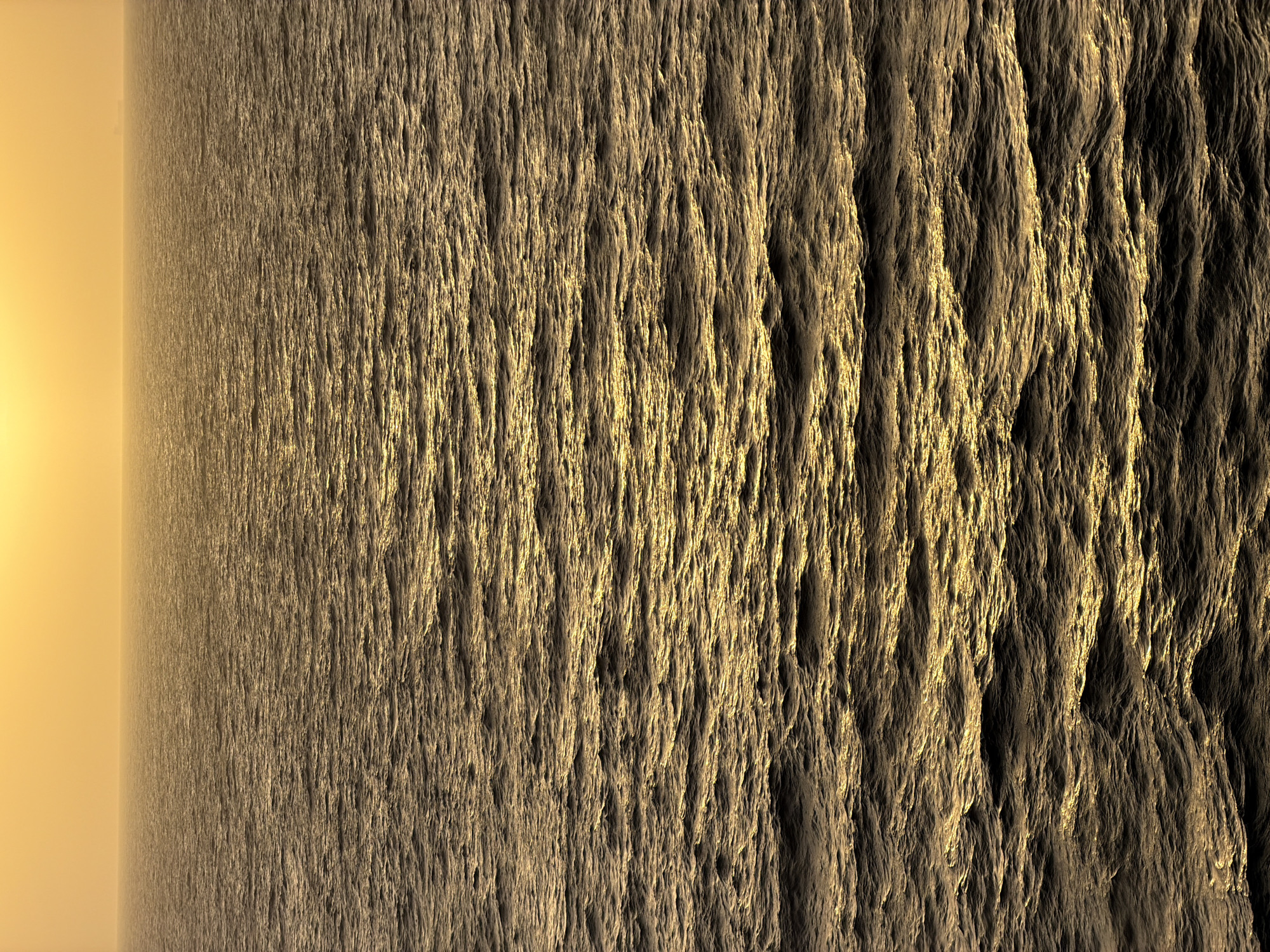 The image shows a vast, textured surface reminiscent of a rough terrain, possibly rock or sand, with deep vertical grooves and ridges. The color palette is dominated by shades of brown and gold, suggesting a desert-like or mineral-rich environment. The left side of the image transitions into a soft, yellow gradient, possibly representing a horizon or a light source obscured by atmosphere. The absence of identifiable objects, people, or subjects, coupled with the abstract nature of the terrain, indicates an unpopulated and possibly otherworldly location. Location in the city of Unknown, Unknown is impossible to ascertain due to lack of evidence.