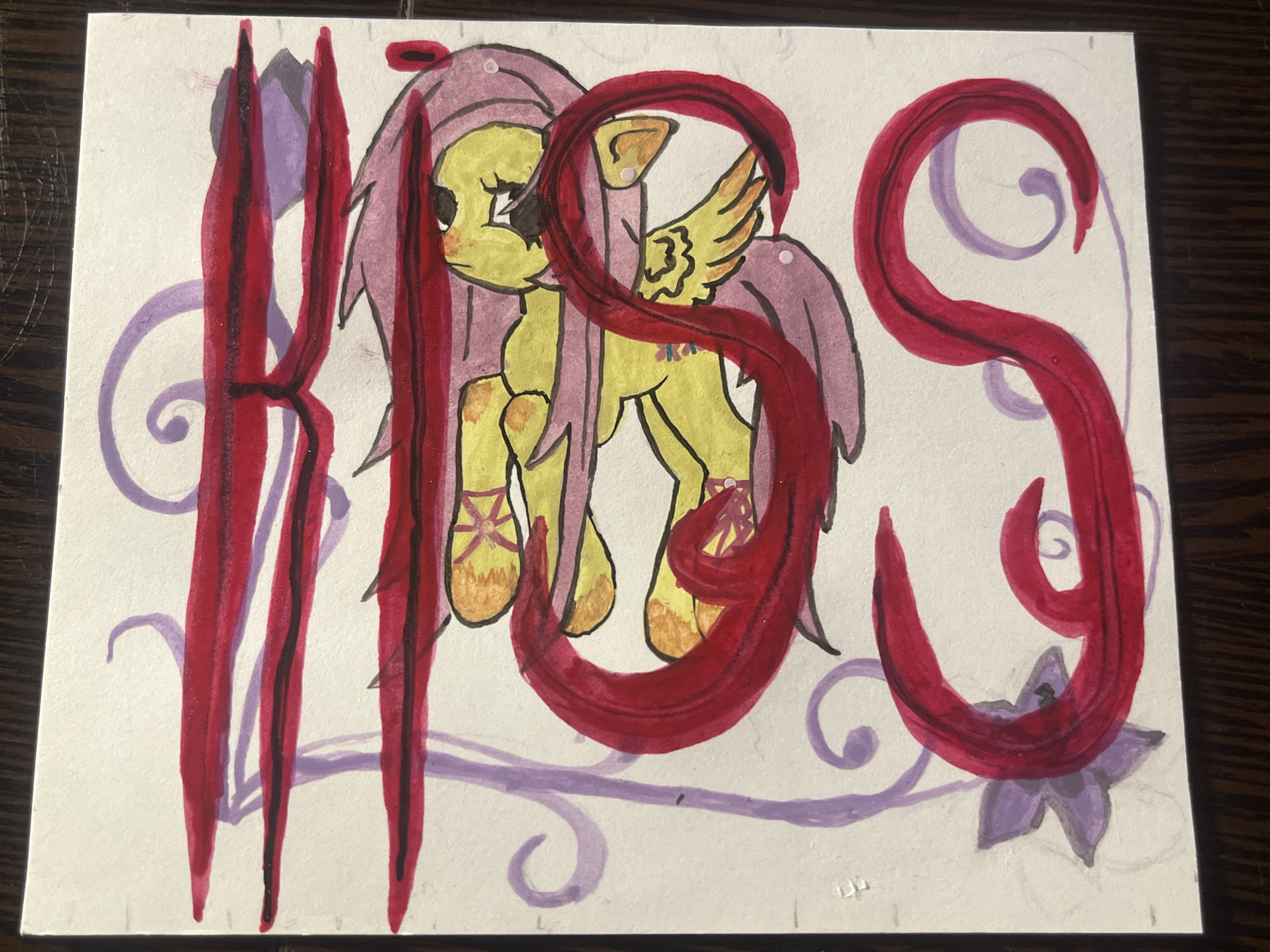 A watercolor drawing on white paper depicts a yellow pony with pink hair, wings, and a cutie mark of three butterflies. The pony is positioned behind large, red, handwritten letters "RBS." Below the letters and pony are decorative purple swirls and a flower. The drawing appears to be on a wooden surface. The drawing does not depict the city of Saint Petersburg, Russia.