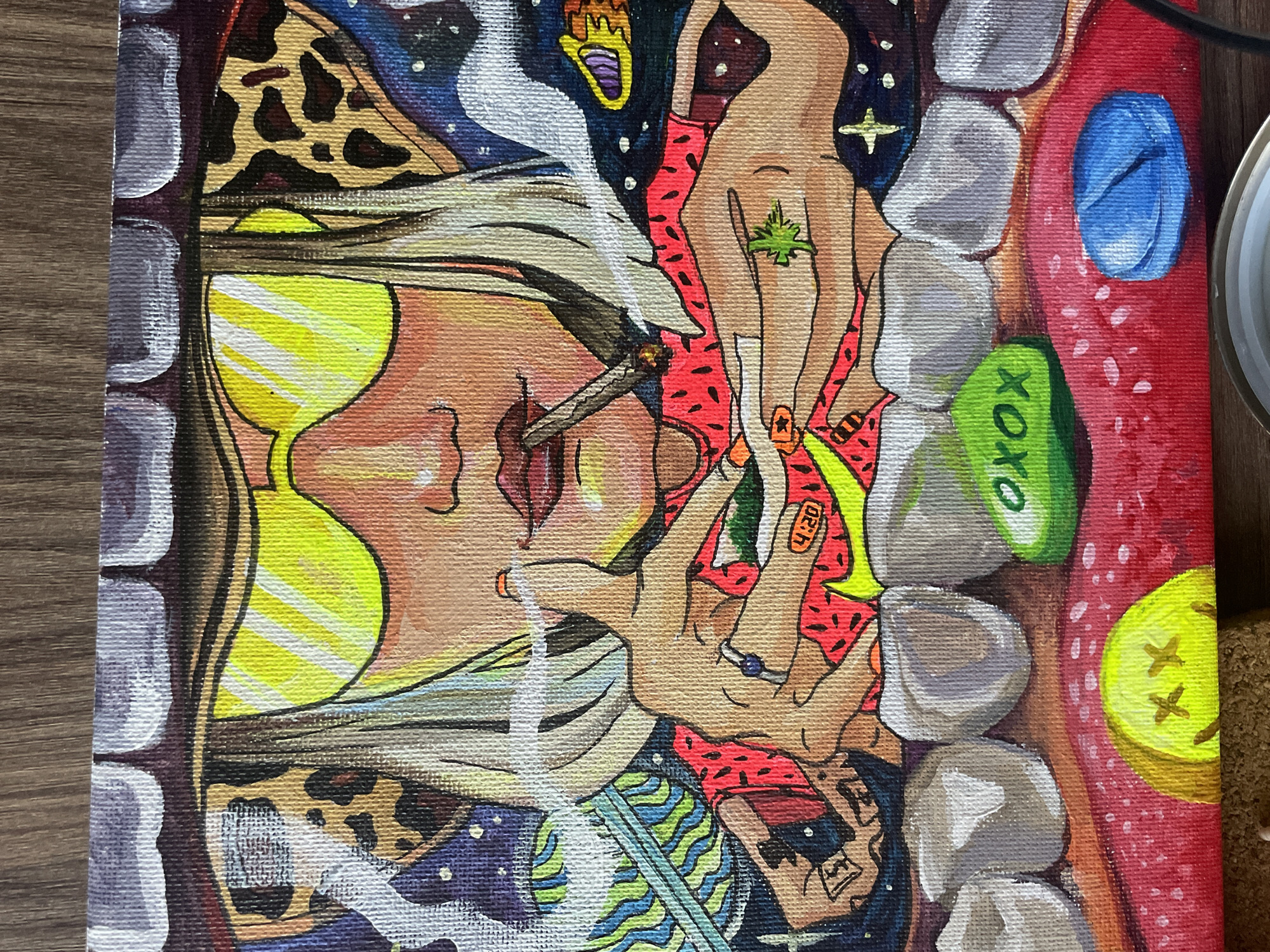 The image is a close-up, top-down view of a painting with a vibrant, surreal aesthetic. The artwork depicts a disembodied mouth and teeth, framing a chaotic scene. Within the mouth, several hands are intertwined. One hand holds a lit cigarette, with smoke curling upwards and obscuring parts of the image. Another hand has a green marijuana leaf symbol on it, and a band-aid with "4:20" is visible on a finger. The background is a starry, cosmic scene with abstract patterns and shapes.
The teeth are painted in shades of white and gray, appearing almost like rocky formations. The gums are depicted in bright red. Several objects are scattered within the mouth, including what appears to be a yellow martini glass and elements with leopard print and a blue and white swirled pattern. A green object with "XOXO" written on it is positioned among the teeth. A bright yellow circle with two "X" marks is visible on the red gum area on the right side of the frame.
The overall impression is one of a psychedelic or dreamlike experience, potentially centered around themes of drug use and altered perception. The style is graphic and stylized, with bold outlines and saturated colors. No specific time of day or weather is indicated, as the scene is abstract and fantastical. The location context of Rawai, Thailand, does not provide any discernible cues within the artwork itself.