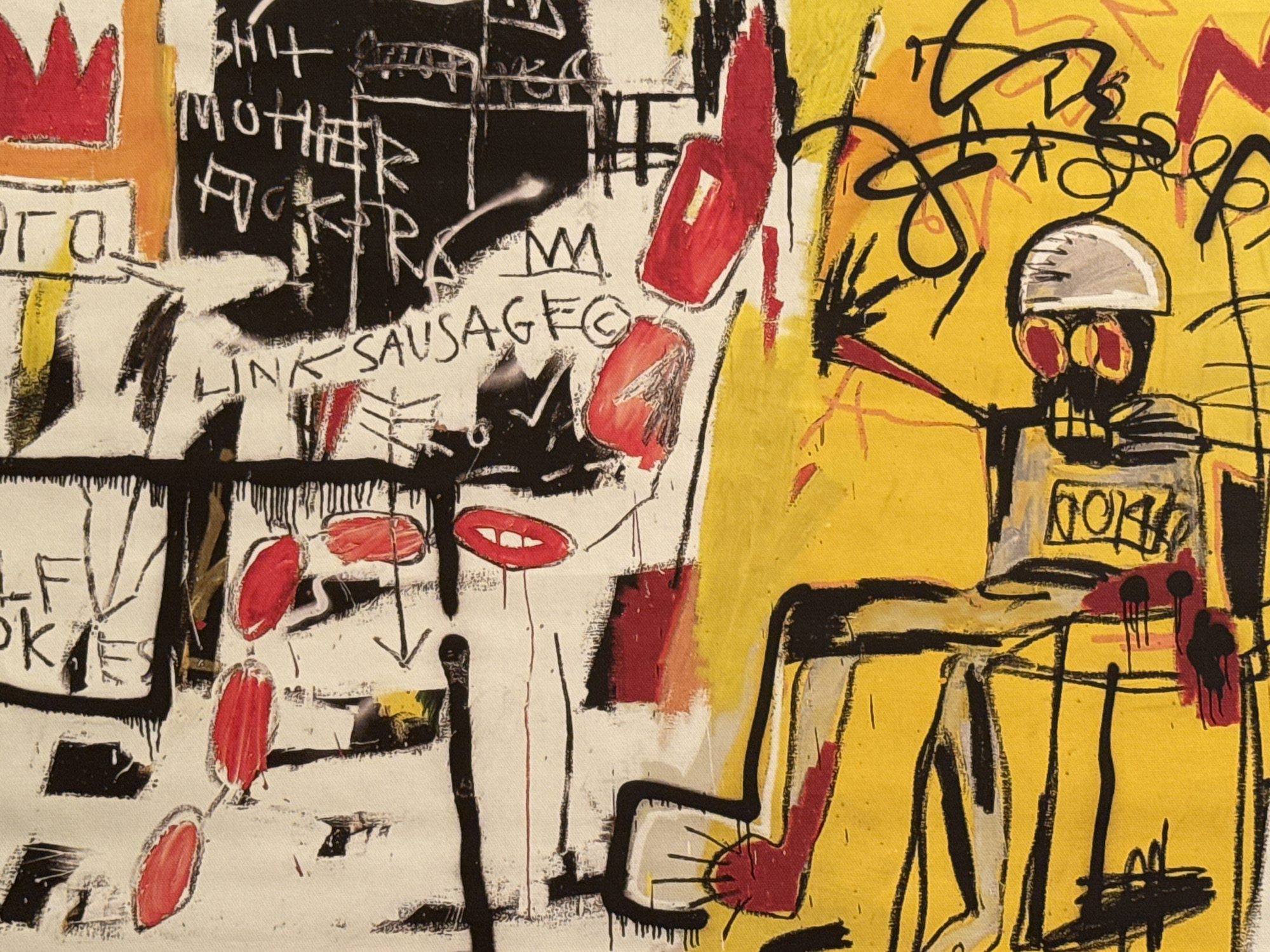 The image is a close-up of an abstract expressionist painting, likely inspired by Jean-Michel Basquiat. It features bold colors, primarily yellow, white, black, and red. The left side of the image is dominated by white, with black scribbled text including "SHIT," "MOTHER FUCKER," and "LINK SAUSAGE." A red crown is visible in the upper left. The right side is primarily yellow, with a figure rendered in black lines. The figure has a silver helmet and red eyes and is seated. A box on the figure's chest reads "NOKI." The painting is likely not set in Moscow, Russia, nor does it depict that city. There are no discernible people, interactions, or environments suggesting Moscow.