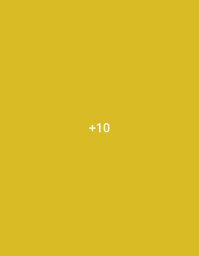 The media file is a square image with a plain, solid mustard-yellow background. Centered within the image is the white text "+10". There are no other subjects, activities, or notable details visible in the image, such as people, objects, or scene elements. The context of Jalingo, Nigeria, does not appear to be directly represented in the visual content of the image itself.