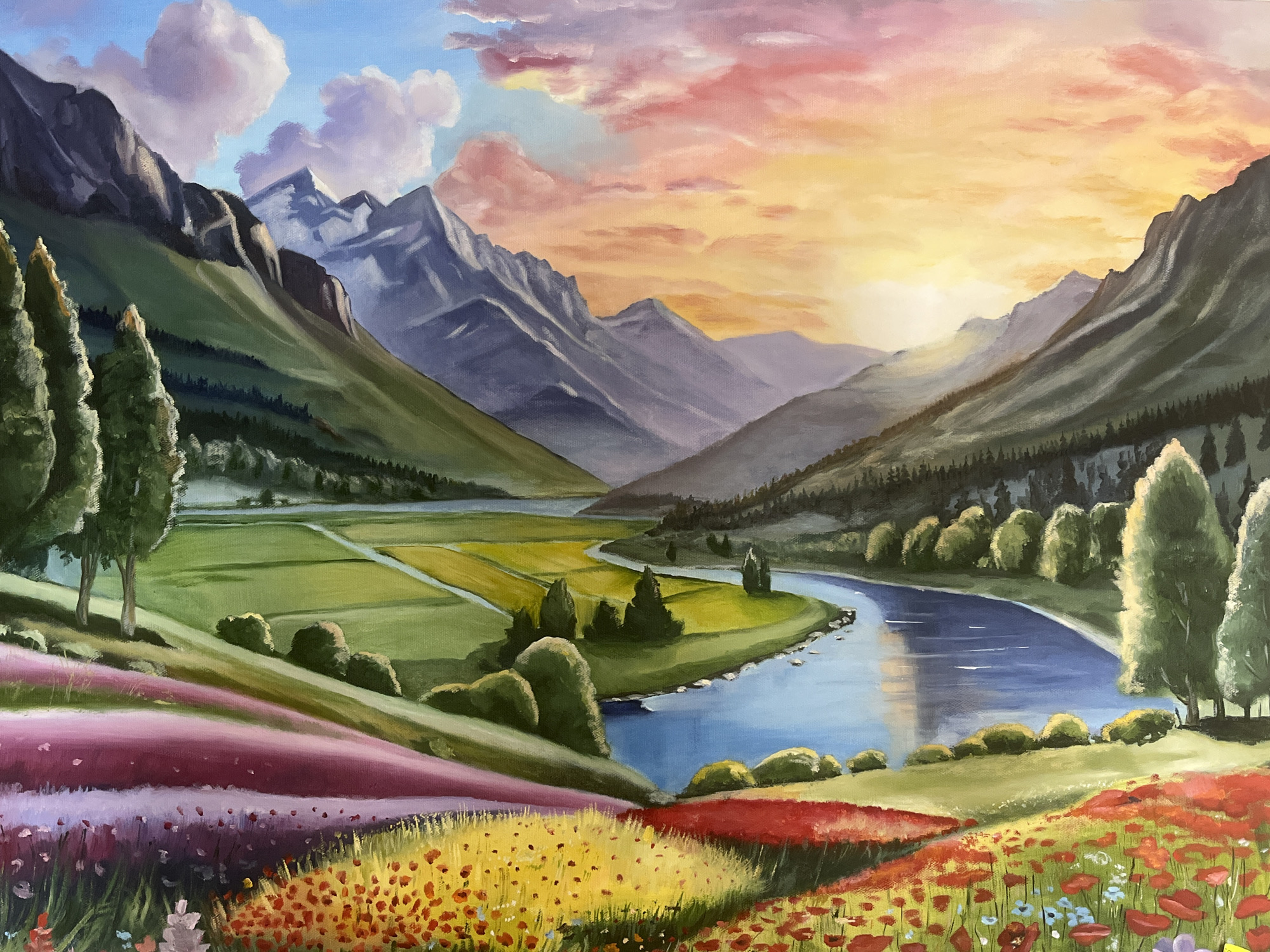This is a vibrant, impressionistic painting of a scenic valley at sunrise or sunset. In the foreground, rolling hills are covered in a profusion of colorful flowers, including red poppies, yellow blossoms, and streaks of purple and pink.
The middle ground features a winding, blue river reflecting the colorful sky, bordered by lush green fields and scattered trees. Further back, the valley narrows as it leads towards majestic, rugged mountains that rise up to meet a sky filled with soft, pastel clouds in shades of pink, orange, and blue.
The painting depicts a tranquil and idyllic natural landscape, with no people or man-made structures visible. The style is loose and painterly, focusing on the interplay of light, color, and form to create an atmospheric and picturesque scene. The painting does not depict the city of Nesebar, Bulgaria, nor does it contain any elements that would suggest that location.