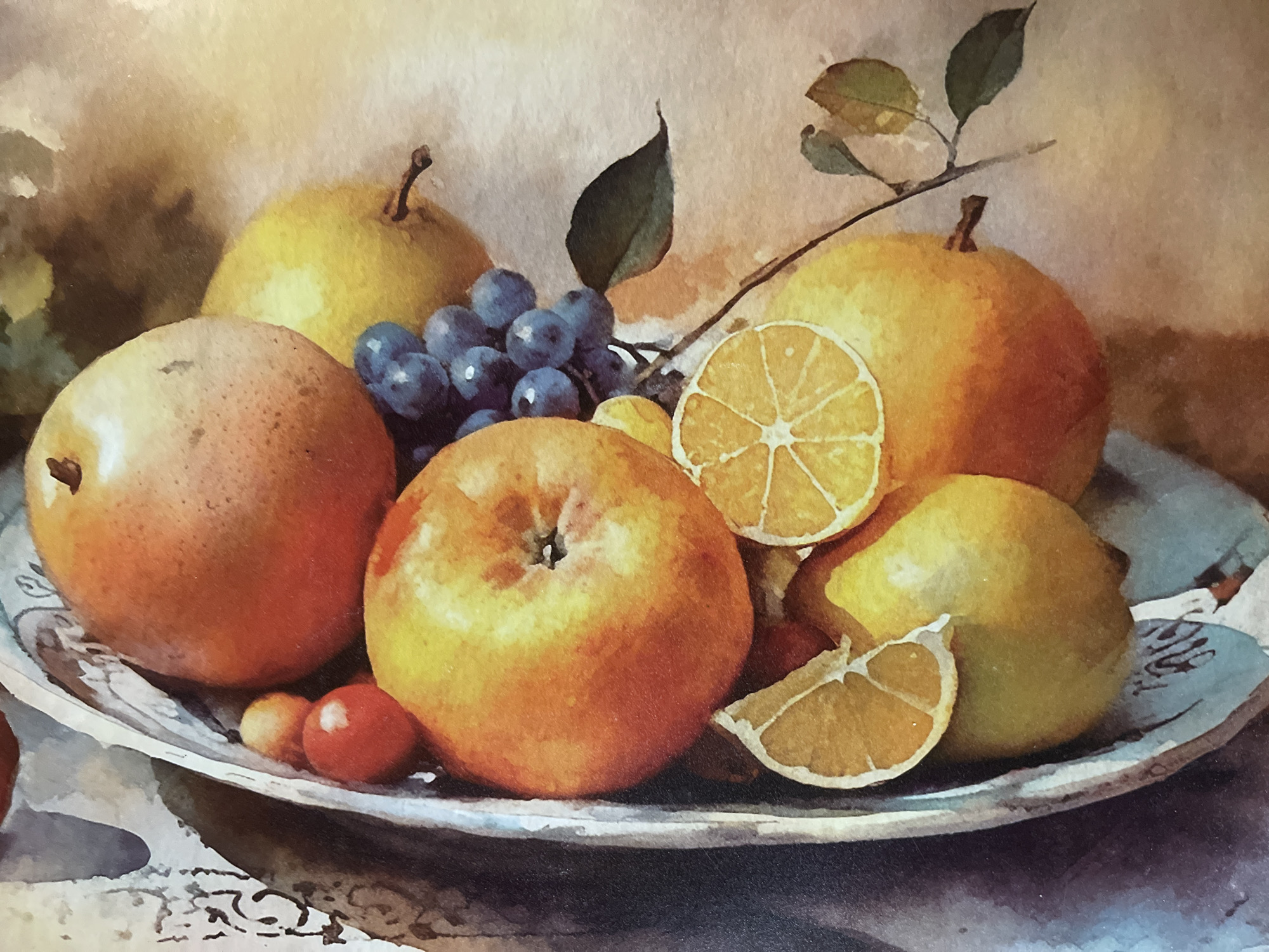 The image is a watercolor painting of a fruit still life, featuring a variety of fruits such as apples, pears, grapes, lemons, and what appear to be cherry tomatoes, arranged in a bowl. The fruits exhibit warm tones, ranging from vibrant oranges and yellows to deep blues and reds. Some of the fruits, like the lemons, are depicted as sliced. The background is softly rendered, suggesting an indoor setting with muted lighting. There are no people or specific city elements visible in the painting, and therefore no connection to Minsk, Belarus can be made from the image itself. The artistic style is impressionistic, with visible brushstrokes and a focus on light and color rather than sharp detail.