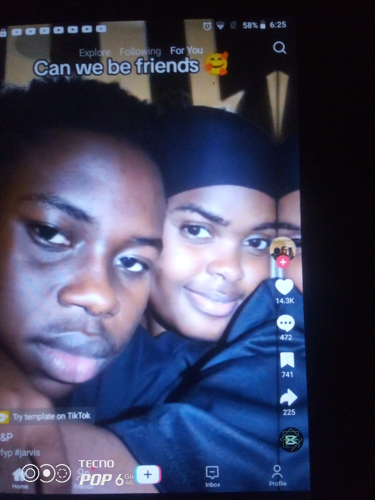The image is a screenshot of a TikTok video, featuring two young individuals, likely friends, looking directly at the camera. The video has text overlays that say "Can we be friends" and "Try template on TikTok". The top right corner of the screen shows the time as 6:25 and the battery as 58%, typical of a mobile device. The bottom navigation bar shows icons for Home, Inbox, and Profile. The video also displays engagement metrics such as likes (14.3K), comments (472), shares (225), and saves (741). The image is a digital capture of a social media platform, not a real-world scene in Howayi, Nigeria or any other city. There is no information in the image that can be used to determine its location within Howayi, Nigeria or anywhere else.
