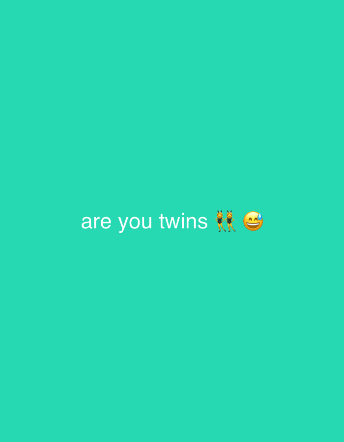 The image displays white text on a solid teal background. The text, centered horizontally, reads "are you twins". To the immediate right of the text are two emojis. The first emoji depicts two stylized figures, typically representing women, standing side-by-side in matching outfits, often associated with twins or dancers (π―ββοΈ). The second emoji is a yellow grinning face with a single bead of sweat on its forehead (π
), commonly used to express nervousness, relief, or awkwardness. The image contains no visual elements that would indicate a specific geographical location such as Milan, Italy, or any other city.
