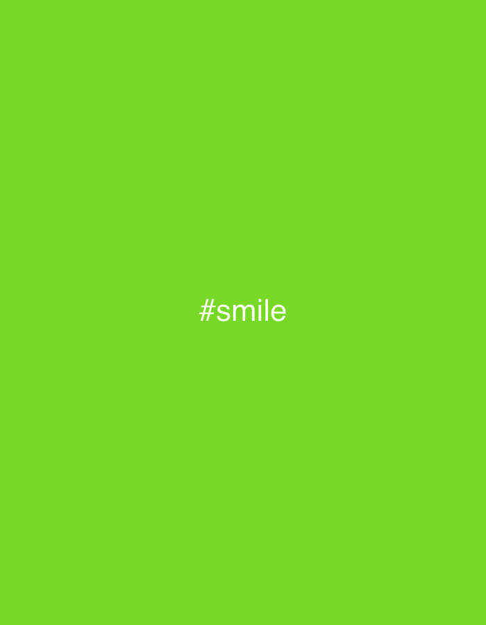 The image is a solid green background with the white text "#smile" centered in the middle. There are no visible elements indicating the location or any objects to identify.