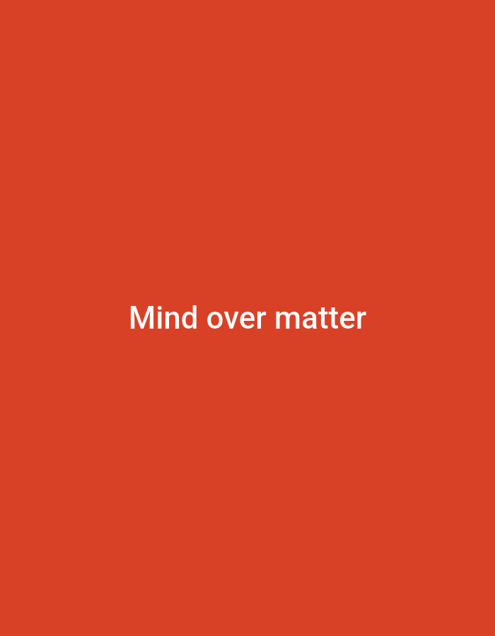 The image displays a plain, monochromatic background of a vibrant orange-red hue. Centrally positioned on this background is white text in a sans-serif typeface. The text reads: "Mind over matter." There are no discernible people, additional objects, actions, interactions, or environmental details present in the image. The image does not depict any identifiable location, including the city of Casablanca, Morocco.