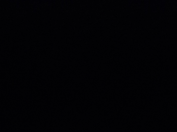 A completely black image with no discernible objects or patterns. The color is uniformly dark across the entire frame, suggesting a total absence of light or imagery.