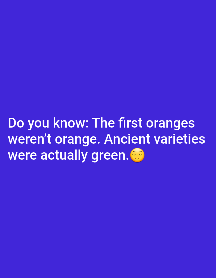 A close-up, eye-level, medium shot captures white text against a solid purple background. The text reads, "Do you know: The first oranges weren't orange. Ancient varieties were actually green." A yellow emoji with closed eyes and a slight smile is positioned at the end of the text. The image appears to be a graphic for social media.