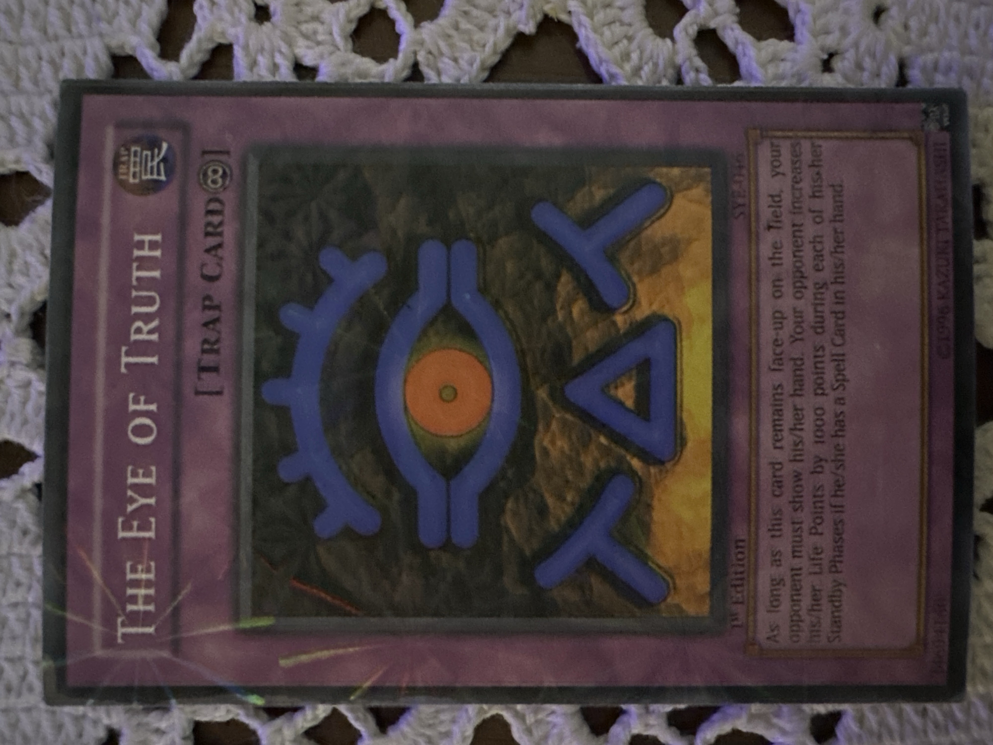 The image shows a Yu-Gi-Oh! trap card called "The Eye of Truth". The card is a purple color and features a stylized eye design. The card's text includes its effects, stating that as long as the card remains face-up on the field, the opponent must show their hand and gains 1000 Life Points during each of their Standby Phases if they have a Spell Card in their hand. The card is labeled as a "1st Edition". The location of the image is not Sofia, Bulgaria.