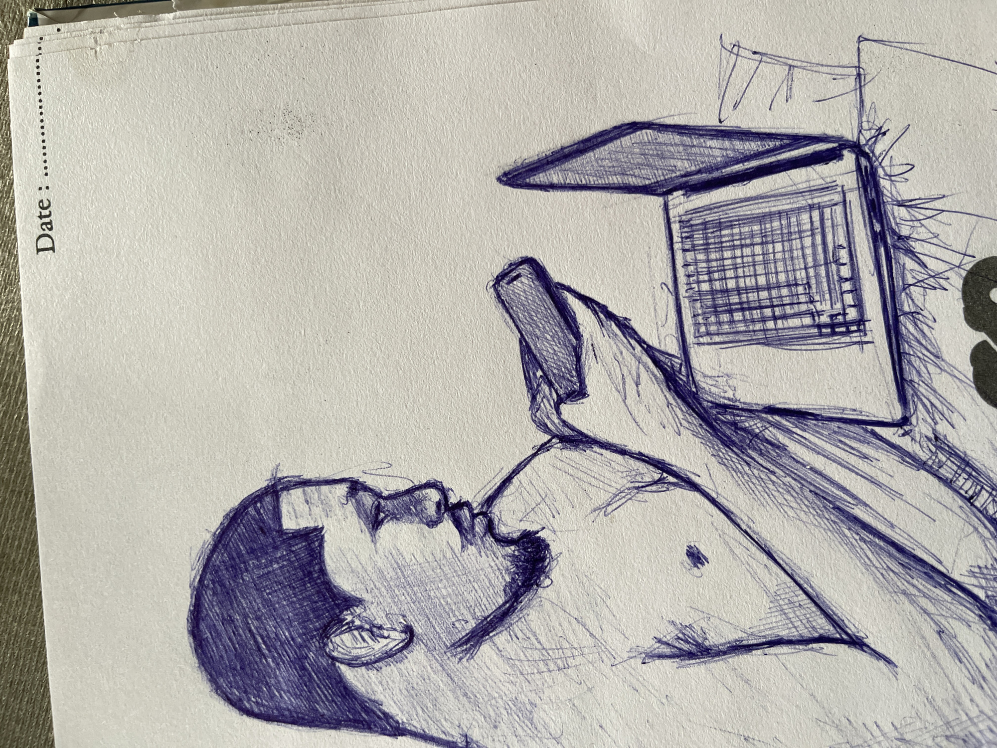 A pen and ink sketch depicts a person, appearing to be male, with short hair and a goatee, looking down at a mobile phone held in their hands. The person is shirtless and appears to be sitting. To the right of the person is an open laptop with visible grid-like lines on the screen, suggesting a display. The sketch is done on textured paper that has a printed "Date: ........." at the top right corner. There are some smudges and marks on the paper. The scene is not identifiable to a specific location in Abuja, Nigeria, or any other city.