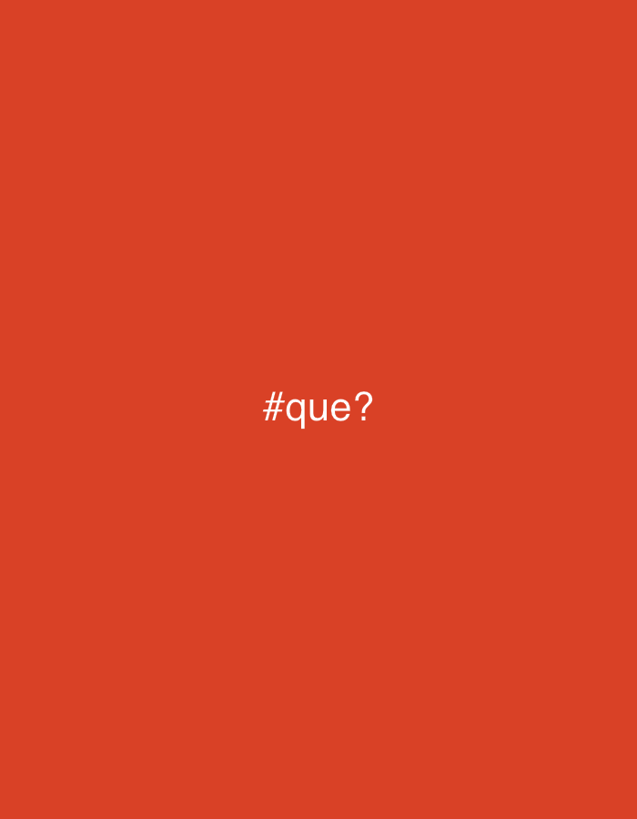 The image is a solid reddish-orange background with the text "#que?" in white, centered horizontally and vertically. There are no other objects, people, or environmental details visible. The image's content does not provide enough information to determine a location in Buenos Aires, Argentina or any other specific location.