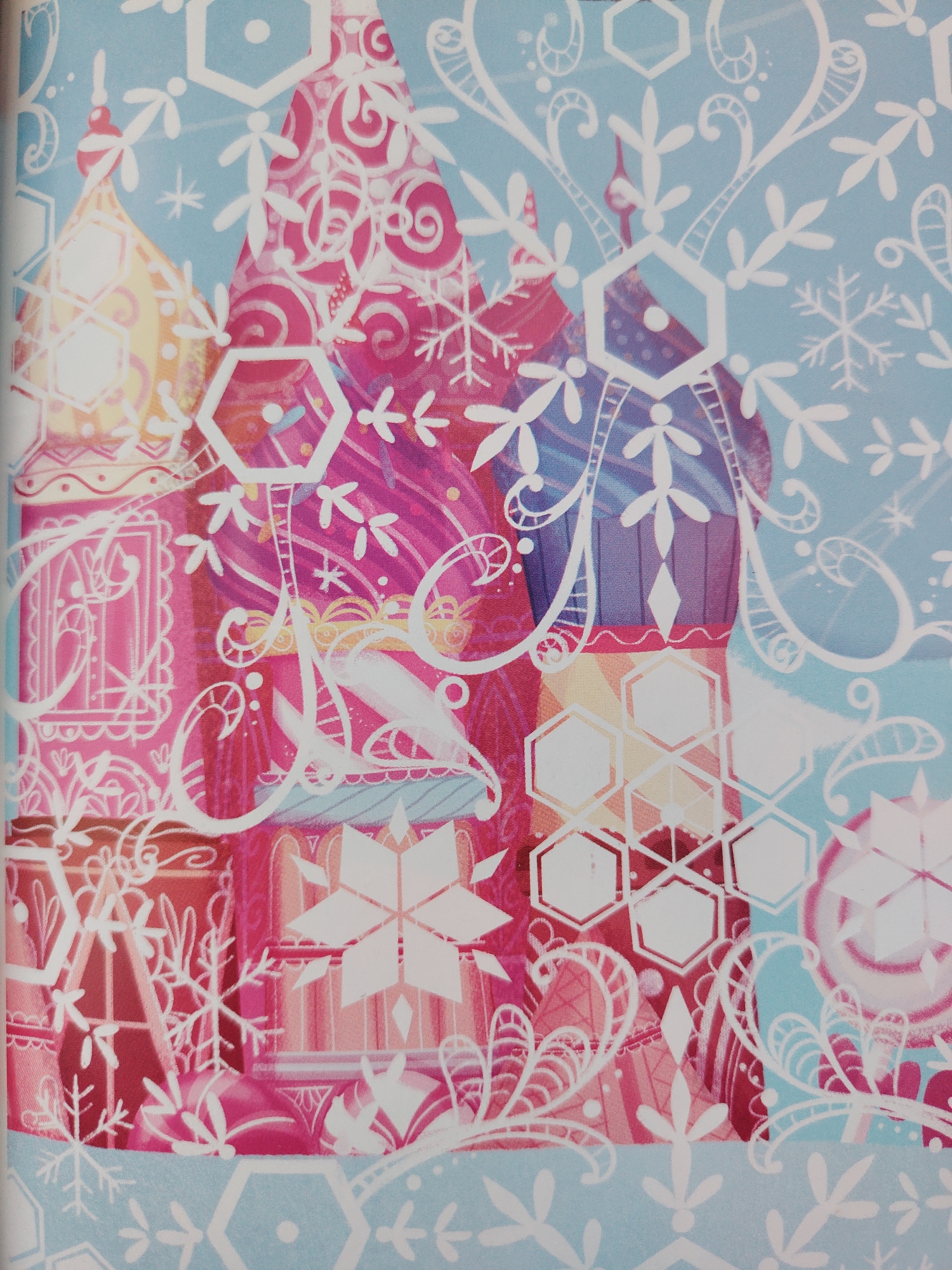 This is a close-up image of a colorful illustration with a winter theme, likely a cover for a book or magazine. The dominant colors are various shades of pink, blue, and yellow, with white decorative elements. The illustration features stylized, ornate domes reminiscent of Russian architecture, possibly a cathedral or palace, overlaid with white, intricate snowflake and floral patterns. Some of the domes are a bright yellow and pink, while others are a deep purple and pink, creating a vibrant, almost fantastical scene.
The white decorative elements are complex and appear to be a recurring motif. These include hexagonal shapes, snowflakes of various sizes, stylized floral or leaf-like designs, and swirling lines that suggest frost or icicles. Some hexagonal shapes contain a simple white dot in the center. The overall impression is one of a festive, possibly magical, winter scene. The artwork has a digital or illustrative quality, with bold colors and sharp lines for the decorative elements. There is no visible text in this portion of the image. The scene evokes a sense of wonder and enchantment, possibly related to a fairy tale or a winter holiday. The lighting appears bright and even, suggesting an indoor setting or a well-lit illustration.