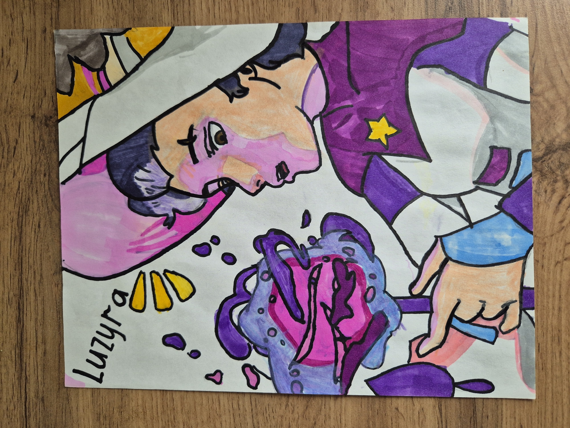 The image depicts an illustration featuring a person looking down at a magical object. The person has fair skin, pink cheeks, and black hair. They are wearing a purple and white outfit with a yellow star on the chest. The magical object in front of them is a swirling mass of purple and pink colors, with dark purple tendrils and pink drops surrounding it. The signature "Luzyra" is visible on the left side of the image. The illustration appears to be drawn on a white paper, which is placed on a wooden surface. The location is Unknown, Unknown.