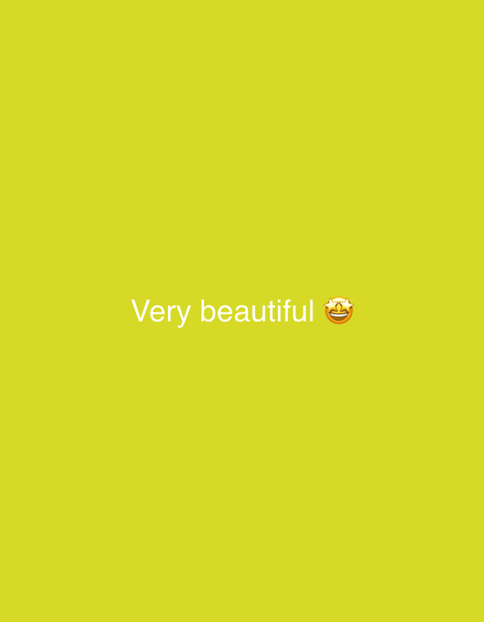 The image displays the text "Very beautiful" in white, with an emoji of a smiling face surrounded by stars to the right of the text. The background is a solid, bright yellow. The location of this image within the city of Sochi, Russia, cannot be determined from the visual information provided.