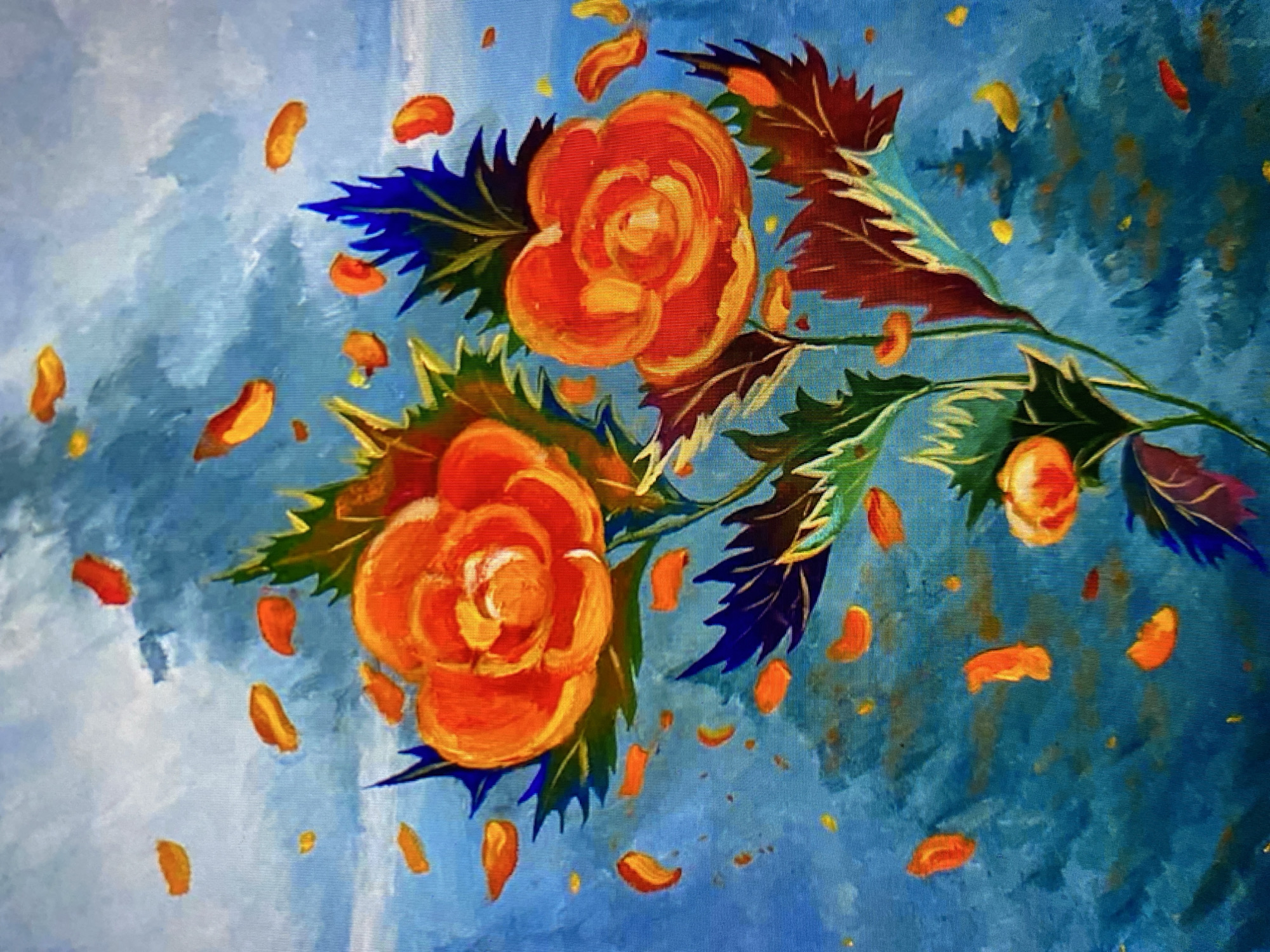 An impressionistic oil painting depicts two vibrant orange roses with yellow centers against a textured blue background. The roses are surrounded by scattered orange and yellow petals, some of which appear to be falling. Dark green and deep blue spiky leaves frame the roses. In the background, indistinct shapes of darker blue and green suggest trees or foliage, possibly shrouded in mist or clouds. The overall style is loose and painterly, with visible brushstrokes that create a sense of movement and depth. There are no people or specific city locations identifiable in the artwork.