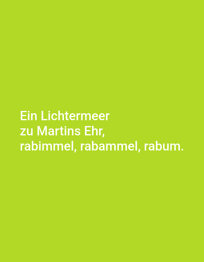 The image is a photograph of white text on a lime green background. The text is in German and reads: "Ein Lichtermeer zu Martins Ehr, rabimmel, rabammel, rabum." The text is centered on the image and appears to be a quote or a poem. There are no people, objects, actions, interactions, or environmental details to describe beyond the text and background color. The image is not located in Tallinn, Estonia.