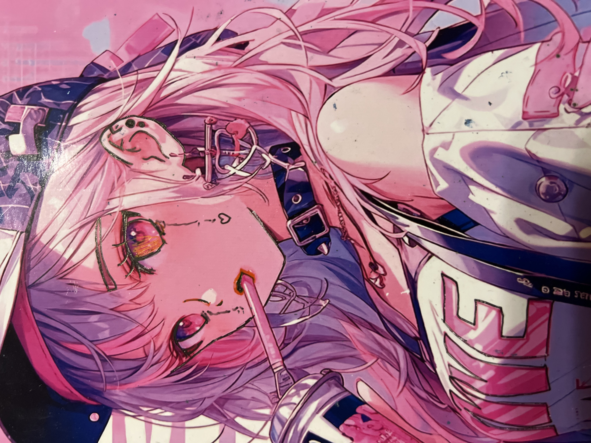 The image is a close-up, full-body illustration of an anime-style character, depicted in a vibrant, almost neon, pink and purple color palette. The character, with long, flowing pink hair, is wearing a white top with large pink letters that appear to spell "NKE". They are also wearing a dark collar with a buckle and a dangling earring. The character holds a pink straw to their lips, which is inserted into a metallic can. Their eyes are large and expressive, with a deep orange and pink iris. The background is abstract, with soft pink and white horizontal stripes and some faint cloud-like shapes, suggesting an urban, possibly stylized, cityscape. There are no elements in the image that can be used to determine the location in Minsk, Belarus.