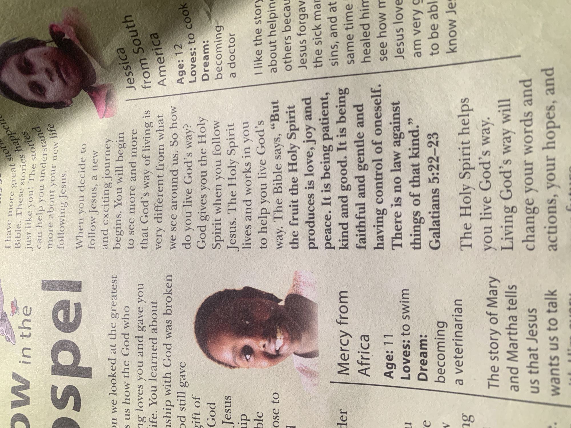 The image is a close-up of a newspaper article with a printed photograph. The article appears to be about faith and religious teachings. There are two photographs visible. The first is a partial image of a young Black girl's face, smiling. She is identified as "Mercy from Africa" with details below her name: Age: 11, Loves: to swim, Dream: becoming a veterinarian. The second photograph is of a young Hispanic girl's face, looking directly at the camera. She is identified as "Jessica from South America" with details below her name: Age: 12, Loves: to cook, Dream: becoming a doctor. The newspaper has columns of text in English, discussing topics such as "the greatest us how the God who loves you and gave you life," "ship with God was broken," and "The Holy Spirit helps you live God's way." The background is a blurred newsprint texture. The location of Jauro Yinu, Nigeria is not mentioned in the image.